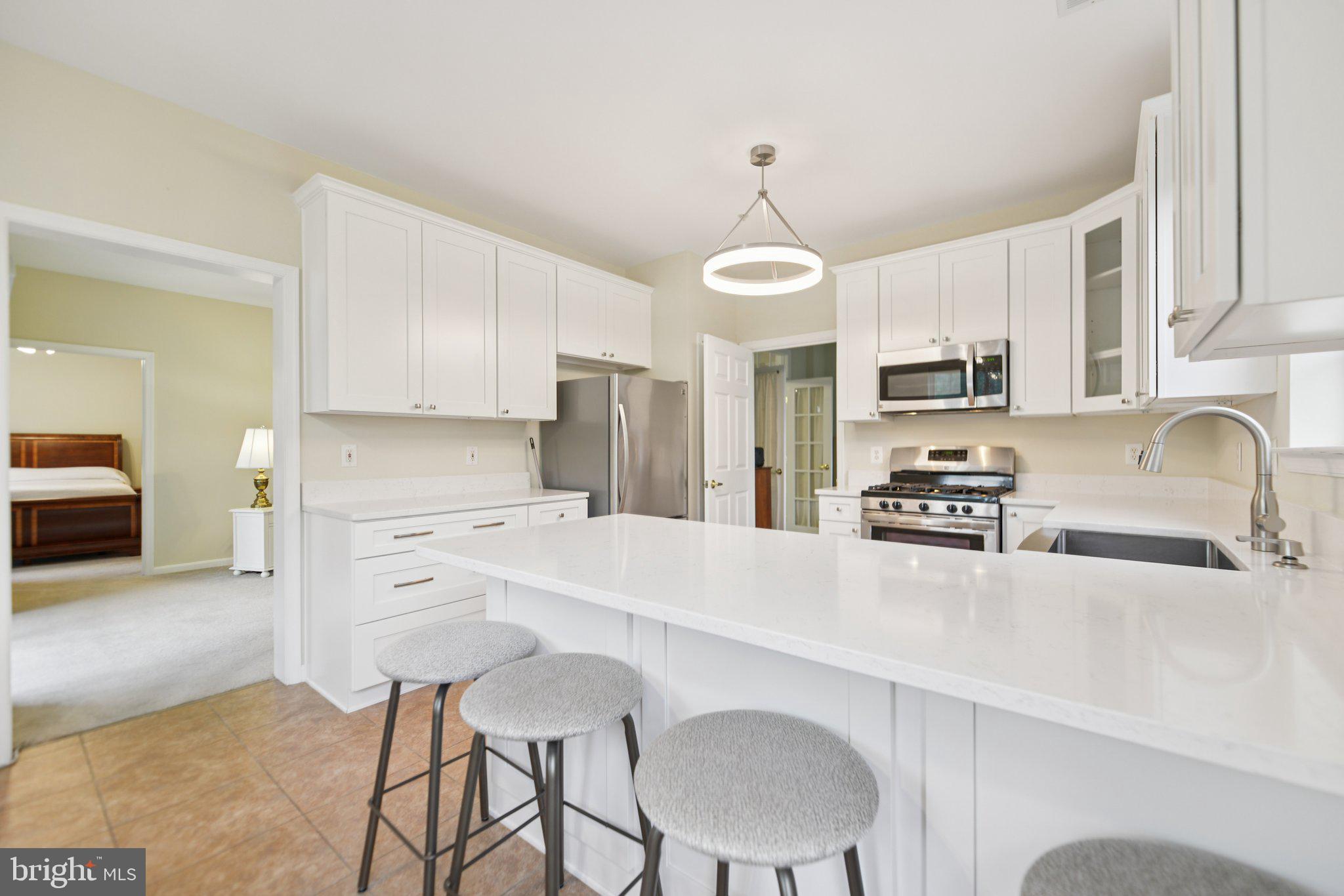 A Rare Corner Gem Designed for Your Next Chapter!
If you’ve been searching for a place that feels just right—that blends comfort, convenience, and that little bit of wow—this former model home might be exactly what you’ve been waiting for.
Set in one of Edgewater’s most desirable 55+ communities, this rarely available corner-unit condo is the largest floor plan in the neighborhood, offering 1,675 square feet of thoughtfully upgraded, low-maintenance living. Sunshine pours in from three sides, filling the home with warmth and a quiet sense of calm.
Step inside to discover a layout that simply makes life easier:
A spacious living room with a cozy gas fireplace
A beautifully renovated kitchen with gas cooking, granite counters, and a cheerful dining space
A versatile den perfect for a home office, formal dining room, reading room, or guest space
Two full bedrooms, including a primary suite with dual walk-in closets and a private en-suite bath
And best of all? A peaceful rear balcony that overlooks the treetops—your own little slice of serenity
And here's something you don’t see every day: this home includes a separately deeded garage and a private storage locker. That’s extra space for the things you love—holiday decorations, golf clubs, gardening tools, or that easel you’ve been meaning to dust off.
A brand-new HVAC system and Water Heater (installed in 2025) give you peace of mind, while the elevator access and low-maintenance lifestyle mean you can spend more time doing what you enjoy.
Community amenities are designed with you in mind: walking trails, a sparkling pool, tennis courts, picnic areas, and even a playground for when the grandkids come to visit. You’re minutes from shopping, dining, medical care, and downtown Annapolis—and just a short drive to everything the Chesapeake lifestyle has to offer.
Whether you're ready to right-size, downshift, or simply want a home that supports your lifestyle—not the other way around—this light-filled retreat offers the ideal mix of ease, elegance, and location.
Come see where your next chapter starts.
