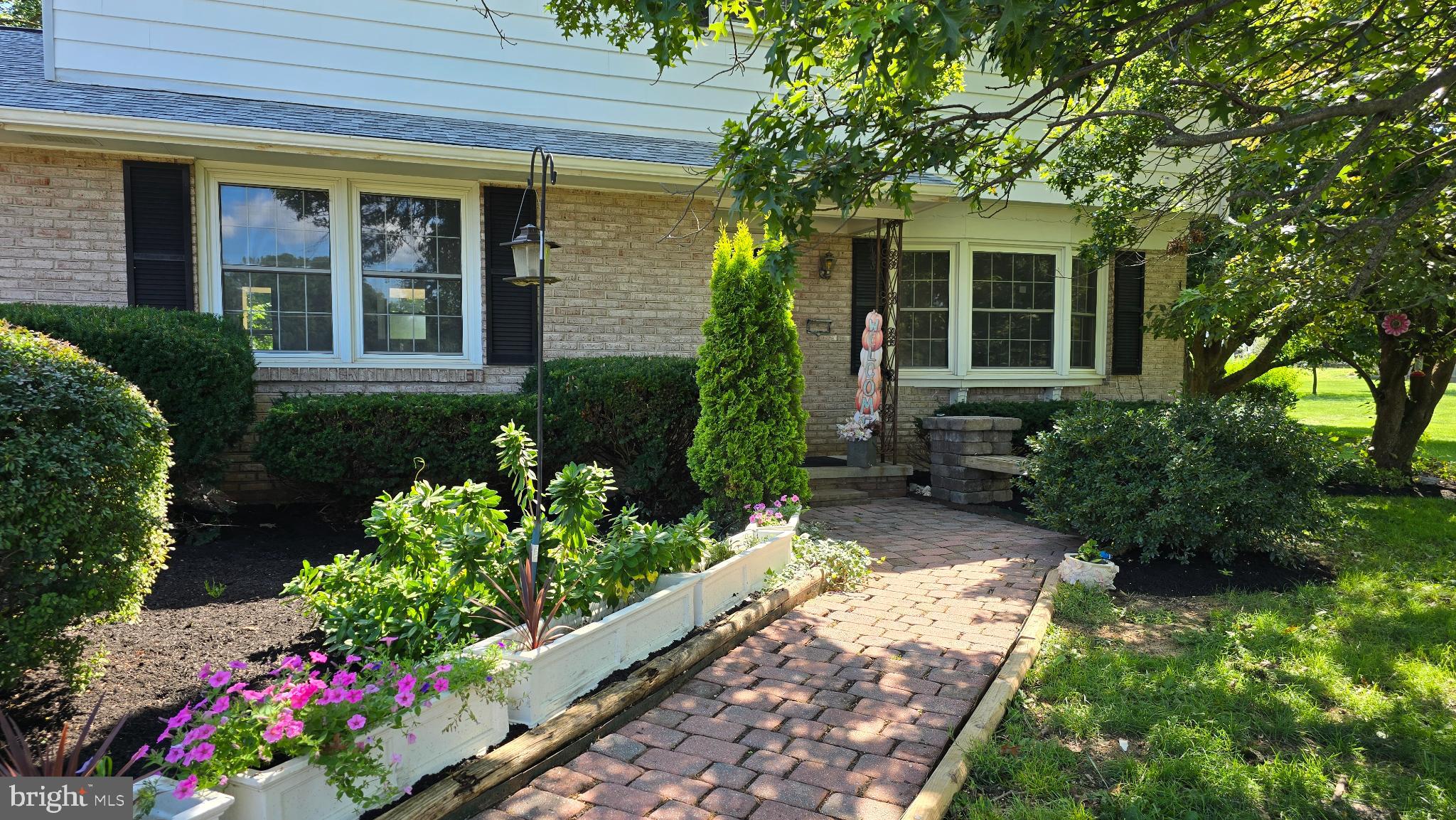 Pick up the phone and schedule your private tour.
Follow the red brick sidewalk to the built in seating just before entering your new front door. You will feel the aura of home upon entry to Living Room with a cozy wood burning fireplace this fall and winter. You will find a large bonus/family room to the left featuring 2 pocket doors. One of those doors leads to the kitchen. Stainless steel appliances, granite countertops, lifeproof flooring and a tray ceiling are desired features in the kitchen. To the right of the kitchen is room for a gathering at the table. You will also find laundry/mud room conveniently located off the garage and rear access. The half bath is also located on the first floor. You will love having a 2 car oversized garage with a side entry and steps leading to the basement. There is a place to park your boat or RV to the left of the garage by side entrance. The basement has a workshop space and 2 cedar closets. It is wired with electric with sockets. Bring your finishing ideas!! Your master suite has a walk in closet and is large enough to accommodate large furniture. Very inviting after a tiring day. 3 more bedrooms with gleaming hardwood floors are on the 2nd floor.. This home sits back off the road with farmland views from the front and back. The outdoor space is level and calming. Plenty of room for gardens and recreational activities. Get ready to make smores on a cool fall evening. This home has somethings old and somethings new. Located a moments away from Roots Market. Feels like home.