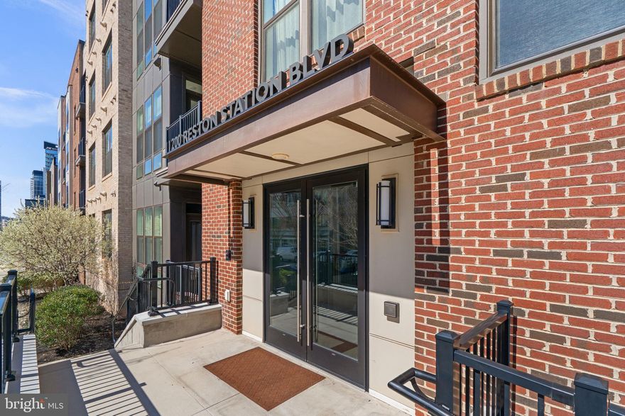 As the largest floor plan in The Lofts at Reston Station, this spacious 2-bedroom (Plus LARGE den with closet space) corner unit shows off with plenty of windows/natural light and private balcony. Constructed in 2019, the home offers an open, airy, and modern layout. The sleek kitchen features modern appliances, cabinetry, counters, and a large island - ideal for entertaining. The primary suite is well appointed with walk-in closet space, closet systems, and a primary bathroom with dual-vanities and a contemporary walk-in shower. Both bedroom floors have been recently updated. Tandem parking space accommodates secure underground parking for two (2) cars. Additional guest parking is available behind the building. Elevator on site. 

The Lofts at Reston Station is a short stroll away from Wiehle Ave-Reston East Metro station along the Silver Line and Rte 267. Access to all of the Reston Association amenities - pools, tennis courts, green spaces, trails, parks, etc. is included. Proximate to groceries, day-to-day conveniences, and all of the restaurants and commerce that Reston Town Center has to offer. In addition to all of the existing attractions at your fingertips, the next-door Reston Row development project will offer a massive upgrade in mixed-use businesses and amenities.