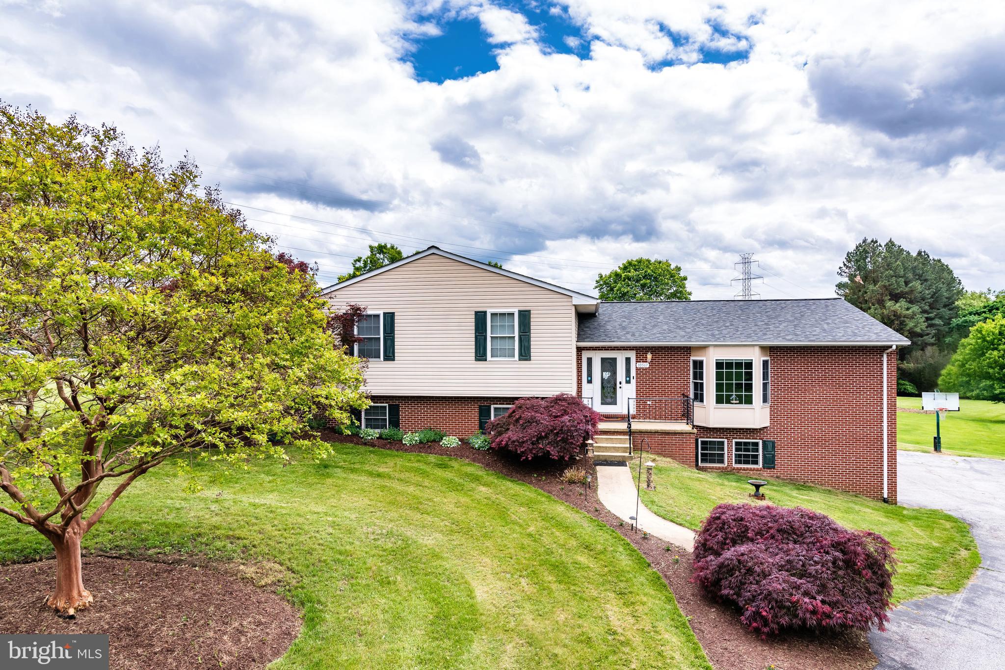 New roof in 2021!! This home is located in the highly sought-after Scaggsville community with, the highest rated in the country, Howard County schools. Make your way amongst the million-dollar neighborhoods with this amazing 3-level home. A short drive, walk or bike ride to Maple Lawn, this home is near amazing shops, restaurants and bustling night-life. This property boasts: Ready-to-use 40-AMP Stage-2 EV Charger, remote-worker’s dream built-in desks, tucked away from the main road, quiet farm land views, built-in natural gas grill, movie-theater style basement, huge garage with smart garage doors, new kitchen appliances, updated fixtures, granite everywhere, two fire-places, heated bathroom floor,
The newly renovated basement offers 10 foot coffered ceilings, in-wall safe, 50+ bottle wine rack, and wet bar. A built in Media center is ready for your big-screen TV with embedded Polk Audio speakers. Laundry room is on the basement level and has been recently renovated with a washtower unit, granite countertop and ample storage. Finally, the basement is a remote-worker’s dream with 20+ feet of built-in wrap-around granite countertop desk space.
Outside the home, you’ll find farm land and mature trees lining the property. The back deck provides lovely views and a natural gas grill for all your family barbecues and get-togethers. The partially fenced half-acre has 2 sheds, plenty of room for a garden and an absolutely massive 2 car garage large enough for 2 full-size SUVs and a workshop.
The main level includes an expansive granite kitchen with updated stainless steel appliances, open pantry, powder room, and a massive living room space perfect for entertaining.
On the upper floor, the owner’s suite is spacious and ready for cozy winters as it has a gas fireplace and an attached bathroom with heated travertine flooring. Also, the walk-in shower large enough for two boasts dual shower heads. The walk-in closet is a dream space with shelving, drawers, and plenty of space for all your clothing. There are two other large bedrooms that share a full bathroom with granite countertop. Each bedroom has an expansive closet and lots of natural light.
Sellers offering $4,000 seller concession for carpet replacement
This home is tucked away from the main street allowing for privacy and quiet compared to other homes on Scaggsville Road. You have wonderful neighbors and families on all sides. Get into this community before 2 new million-dollar housing developments are finished nearby!!