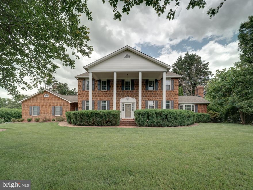 This is a custom built all brick home on 1.4 acres with outstanding upgrades thru-out.  Follow the brick walkway, pass the breezeway door, to the brick front porch with columns. Walk into the foyer of this center hall colonial  and feel the  quality of this beautifully designed home with  9' ceilings and custom crown moldings in almost every room. 4" solid hardwood floors are found thru-out on the main and upper level. From the foyer, a view  to the back of the hallway  opens to the sunroom, a place to relax and unwind with a good book or  enjoy a cup of coffee and the morning paper.  The living room features a faux fireplace but it's hard to tell plus lighted wall sconces, giving this room a truly elegant feel. The spacious dining room has French doors and is well served next to the kitchen. The kitchen is open room  with lots of cabinets and a center island to help prepare meals plus an eating area to serve them. Vaulted ceiling and skylights are found in the family room located off of the kitchen with a large mantle and wood burning fireplace. Sliding glass door leads to patio and deck, great for cooking outdoors.  Nice size home office on main level, could be modified to a bedroom if needed. A breezeway between the office and garage is where the laundry room  ( 11x8) is located, complete with a coat closet and luxury vinyl. 
There is a super entertainment area in the lower level, used as a game room, tv room, darts and parties. Custom built  bar w/ sink plus a beverage refrigerator conveys. Den could be used as a  4th bedroom or whatever space you need it for. There is also a full bath. For all you storage needs there is an large unfinished storage room that holds a lot of stuff. Porcelain tile floors are so durable in the rec. rm.  and there is carpet in the den. 
Upper level bedrooms are spacious and all have  walk in closets. The master bathroom features 2 vanities, a claw foot soaking tub and a shower stall, plus vaulted ceiling and skylights. Both upper bathrooms have been remodeled. 
1.4 acres of professionally landscaped yard of mature trees and numerous variety of flowers and shrubs blooming from spring thru fall. Truly your private Garden of Eden.  Fruit trees & shrubs include, blueberries, raspberries, figs, apple and pears.
HVAC was replaced in Dec. The architectural shingled roof was replaced approx. 5 years ago, including the shed.  Gutters guards were also  installed at that time. Whole house electrical inspection was done in Oct. and an electrical panel rejuvenation completed, replacing all breakers and adding  surge protection in the panel and GFCI protection thru out the house. Windows were replaced ( except the sunroom )  and the  warranty conveys.