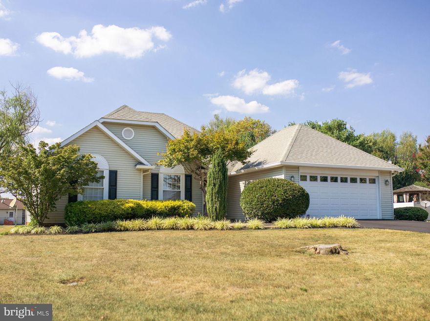 Welcome to this inviting ranch-style home nestled on a generous .46-acre lot in the well-established community of Orchard View Estates. With 3 bedrooms, 2 full baths, and a wealth of features, this property offers the perfect blend of comfort and convenience.  As you step inside, you'll be greeted by a spacious living room featuring a corner gas fireplace, an ideal spot for cozy evenings. Crown molding adds an elegant touch, creating a warm and inviting atmosphere. The built-in TV area is perfect for your entertainment needs.  The well-appointed kitchen offers everything a home chef could desire. Adjacent to the kitchen is a bright and airy dining area, also adorned with crown molding. It's a great space for hosting family gatherings and dinner parties.  The primary bedroom is your retreat, complete with a walk-in closet for all your storage needs. The en-suite primary bathroom boasts dual sinks and a tastefully tiled shower, ensuring a serene start and end to your day.  Step through two sets of French doors from the living and/or dining areas onto a brand-new deck. It's the perfect place to enjoy morning coffee or host barbecues in your gorgeous landscaped yard. With approximately 0.46 acres, there's ample space for gardening, play, and outdoor enjoyment.  The property includes a convenient 2-car garage for parking and extra storage space. Additionally, a shed provides room for tools, equipment, or a workshop.  This home offers more than just comfort; it's situated in a highly convenient location. Close proximity to the VA Medical Center, Proctor and Gamble, Amazon, and commuter routes to VA, MD, and D.C., make it a prime choice for those seeking a balance between work and leisure.  Don't miss the opportunity to make this charming ranch-style home your own.