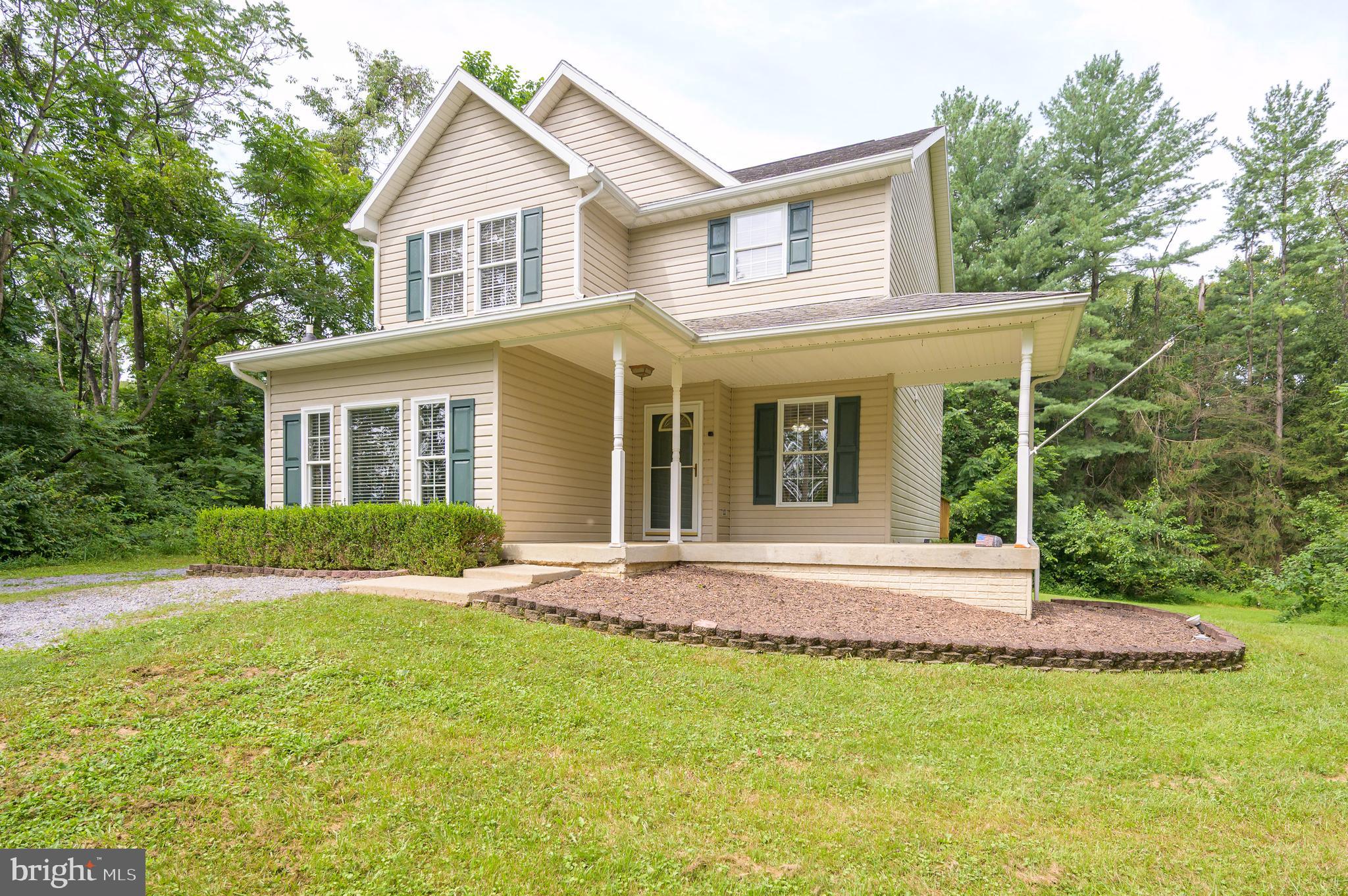 With Potomac River boat launch access, a spacious three-car garage, and a beautifully maintained home, this property truly has it all. Nestled in the sought-after Potomac Heights subdivision and surrounded by mature trees, this 3-bedroom, 2.5-bath residence offers peace, privacy, and the perfect blend of comfort and convenience. Sitting on nearly an acre and a half, there’s ample space in both the front and back yards for outdoor enjoyment. Step inside to find a generous family room—perfect for cozy movie nights or hosting friends for the big game. The kitchen is a standout feature, anchored by a large island that offers plenty of prep space and room for casual dining or entertaining. All bedrooms are located on the second floor, including a spacious primary suite with a large bathroom featuring a relaxing soaker tub and a walk-in shower. Out back, enjoy a freshly stained and illuminated 12x24 deck—ideal for outdoor gatherings or quiet evenings under the stars. Car enthusiasts, woodworkers, and hobbyists will appreciate the separate 28 x 40 detached garage, which is insulated and includes a second floor, offering endless possibilities for use. The home also offers washer and dryer hookups on both the second floor and in the basement for added flexibility. The walkout basement itself is unfinished, providing a blank canvas for future expansion, storage, or a custom space to fit your needs. A three-year-old water heater adds peace of mind. With a prime location close to schools, shopping, dining, parks, and major highways, this home checks every box. Don’t miss your chance to own this unique and well-appointed property in Potomac Heights.