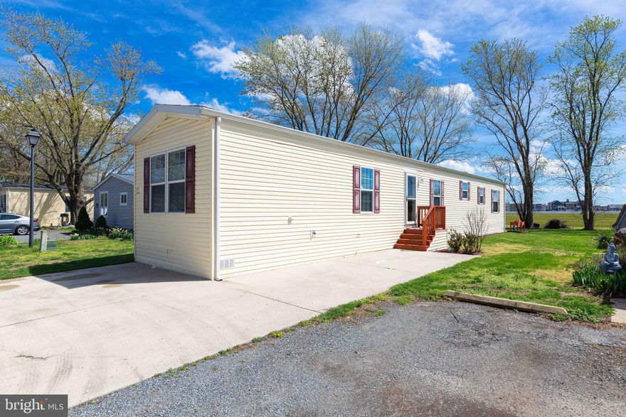 Don't miss this pristine and well maintained 3 bedroom 2 bath  home in Whispering Pines MHP located in Lewes Delaware.  This 2019 model  boasts a  large great room  area and plenty of room for dining and entertaining.  The well equipped kitchen features a deep basin sink and a ceramic tile backsplash.  The split floorplan has the owners suite  with custom board & batten feature wall at one end  of the home. The other 2 bedrooms and bath at the other end of the home  for privacy. Laundry is located near the owner's suite with front loading stackable washer/Dryer.  A rear patio with a peaceful view is sure to be your favorite outside spot to enjoy coffee or a glass of wine.  The community pool  and playground is a short walk away and the community is adjacent to the Georgetown- Lewes bike trail.   Nestled less than 5 miles from downtown Lewes and a short drive to the Rehoboth Beach Boardwalk as well as all of the  restaurants  and nightlife that the area has to offer.  Schedule a tour of this home today as it will not last long.  Park approval through application is required: credit check,  background  check and income verification are required.