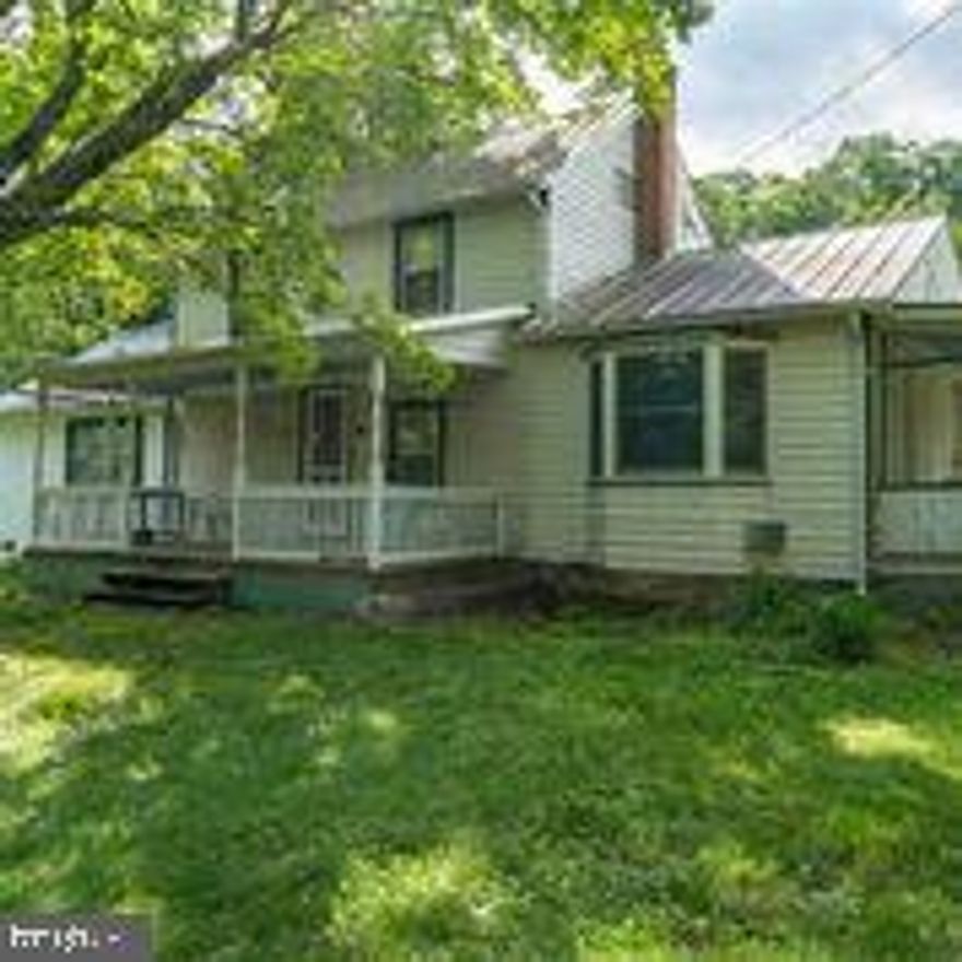 Log Home at Hart, a mid 1800's log home is believed to be the center of this beautifully situated farmhouse. The restoration possibilities are here with one exposed wall for review.  Setting on 10 plus acres, a mixture of level and sloped land contains fruit trees, and hardwoods.   The second building on the property believed to have its own well and septic it has been used as a workshop / storage but could be additional home or business location with a bit of hard work.  Unrestricted land and has No HOA so the possibilities are endless.