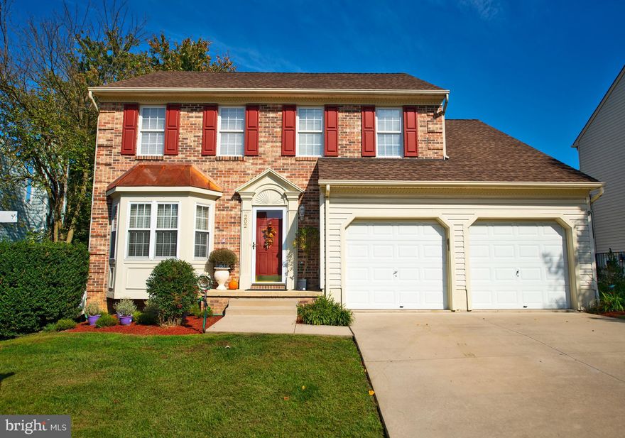 Fabulous brick front colonial w/ a great layout &  lot! Updated eat-in kitchen w/ granite counters & stainless steel appliances (gas range) opens to family room w/ wood burning fireplace, ceiling fan and sliders to deck/fenced rear yard. Light & bright living room w/ beautiful bay window & dining room with crown molding & chair rail. Wide plank floors, half bathroom & large 2-car garage round out main level. Upper level features 3 huge rooms, large full hall bathroom with updated tile floor, and ensuite primary bedroom w/ fabulous vaulted ceiling. Lower level plumbed for a half bath and pre-wired to be easily finished. Lower level & garage wired with 220. Architectural shingle roof, high efficiency gas HVAC, water heater (2018), double hung windows. Super convenient location!