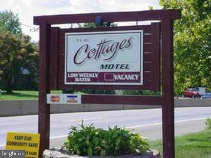 Seller is motivated! Well maintained Hotel/Motel business know as "The Cottages" consisting of 18 units of which 7 are cottages with keyless entry for each unit. Each tenant has their own thermostat. Main building consists of 11 units all well maintained. Business has excellent income. Also included are EDU's with the property for possible expansion or other permitted uses. No approval or plans have been submitted to the township. Parking: Off Street parking 11-25 car, garage, paved parking. New roof and new blacktop around building.