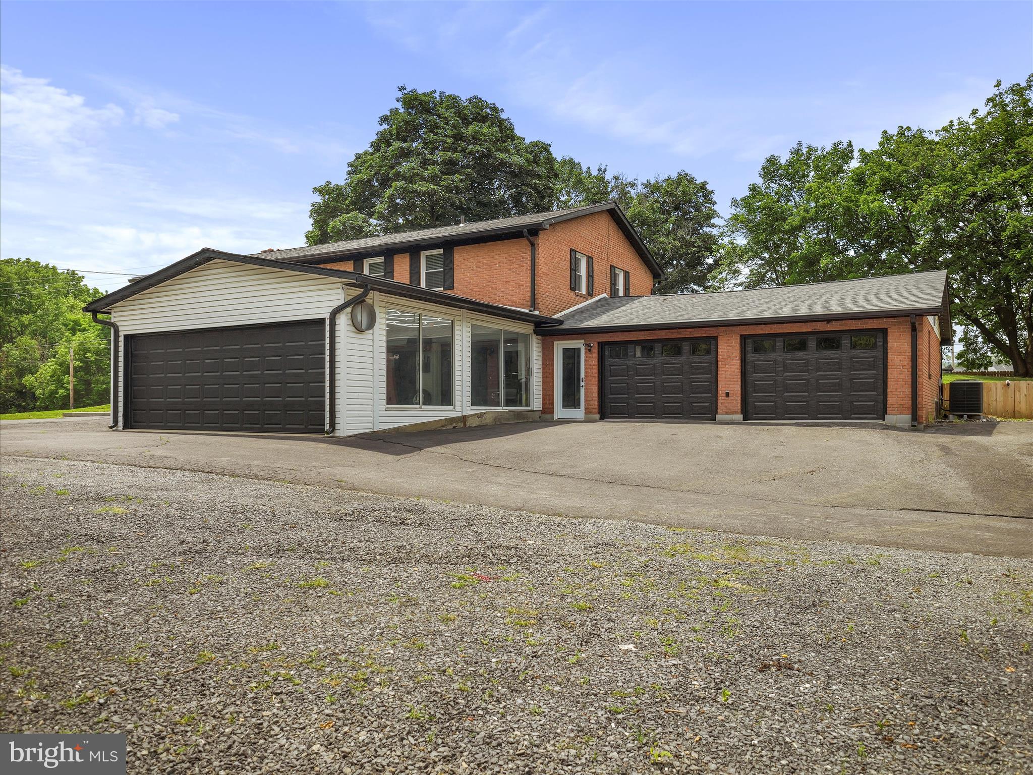 Stunning Modern Brick Rancher with Full Finished Basement & 6-Car Garage spaces. Perfect spot for car detailing and/or car sales! Welcome to this beautifully updated all-brick rancher that perfectly blends classic charm with sleek, modern upgrades. This spacious home features a full finished basement and boasts a rare 6 garage spaces—perfect for car enthusiasts, hobbyists, or those in need of ample storage or commercial use as well. Inside, you'll find tasteful, high-end finishes throughout, including an open-concept layout, a designer kitchen with premium appliances, updated flooring, and stylish lighting. The entire home is set up with smart lights and devices. The finished basement offers incredible flexibility—ideal for a home theater, gym, guest suite, or recreation room and features a full bath and a half bath accessible from outside. Step outside to enjoy a well-maintained yard that has a large fenced area great for kids and pets. With attention to detail in every corner, this home is truly move-in ready. Key Features: 3 Bedrooms | 3.5 Bathrooms All-brick exterior with new windows Full finished basement adding over 700 sq ft of space and bar space with fridge. 6-car garage (attached & detached) Modern kitchen and bath upgrades Spacious, flexible floor plan A quick list of highlights and new items includes: HVAC, windows, roof, 6" gutters, smart soffit light around the entire home, updated kitchen appliances with a gas stove and drawer microwave, interior and exterior doors including garage doors with new smart openers, and much more. Tons of available parking behind the house, the perfect spot to live and run your business with great road frontage on 1.5 acres. Don’t miss your chance to own this one-of-a-kind property that combines modern living with unmatched garage capacity!