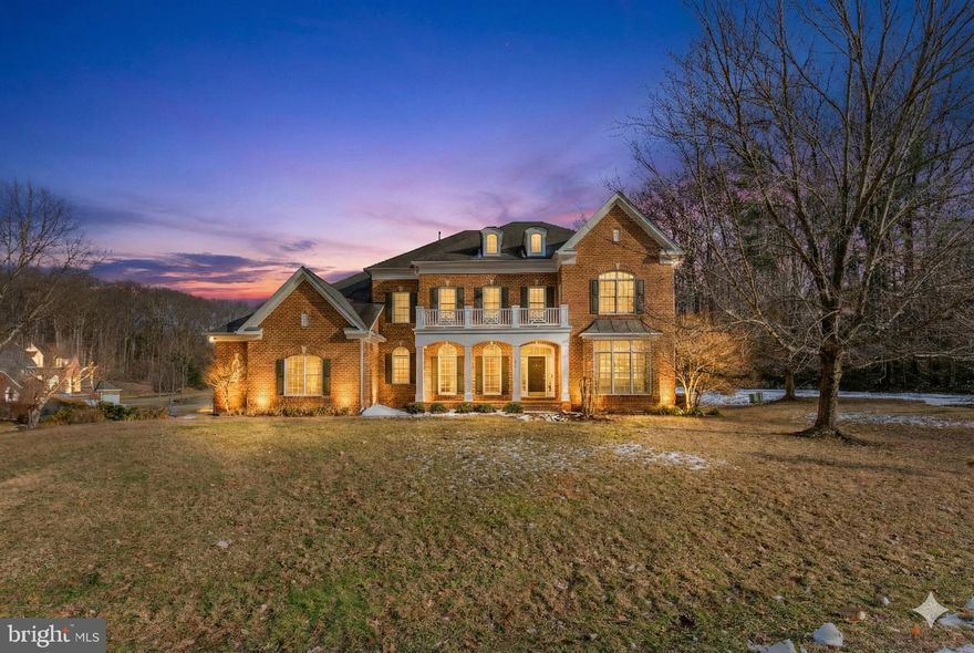 Professional Pictures will be uploaded on Friday.  A Rare Estate of Timeless Elegance and Scale. This extraordinary residence, offering over 5,200 square feet across the top two levels, masterfully blends architectural craftsmanship, refined luxury, and grand-scale living. Every detail has been thoughtfully curated using premium materials, creating an impressive and enduring home. Set on nearly half an acre. The home features five expansive bedrooms, each with its own en-suite bathroom, a dedicated private office, formal living and dining rooms and two half bathrooms providing exceptional comfort and functionality for everyday living and entertaining. A magnificent foyer sets the tone upon entry, opening to soaring two-story ceilings, rich hardwood floors, and an elegant staircase. At the heart of the home is a stunning chef's kitchen, showcasing a massive center island, custom cabinetry, high-end appliances, elegant countertops, designer lighting, and a fireplace, creating a natural gathering space for family and friends and perfectly designed for entertaining on any scale. The adjoining open living spaces are filled with natural light and architectural interest, highlighted by graceful archways, a second fireplace  in the family room, and seamless flow throughout the main level. The unfinished  lower level offers endless possibilities, ideal for a home theater, gym, wine cellar, or additional living and entertainment spaces, allowing the next owner to customize to their vision. Every level of the home reflects superior construction, refined finishes, and thoughtful design. Crafted for those who value luxury, space, and uncompromising quality, this is a rare opportunity to own a truly exceptional estate. The home also includes access to the highly desirable Lake Barcroft, offering fishing, boating, and swimming across five sandy beaches. Conveniently located with easy access to major commuter routes, Washington, DC, Tysons, and Alexandria.