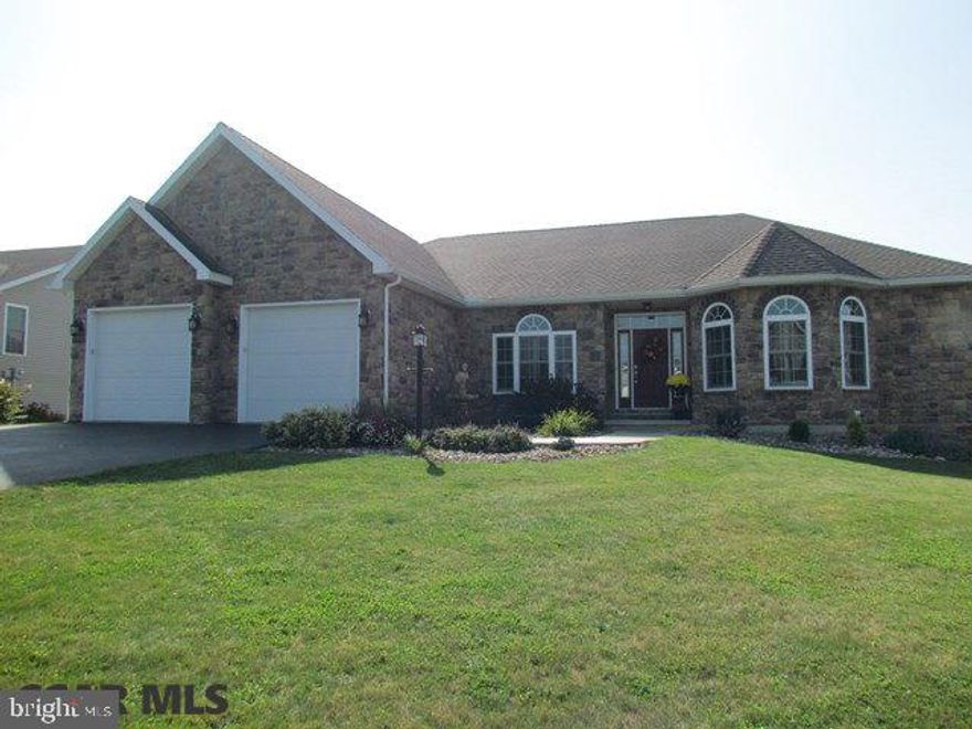 Beautiful and spacious living in Bellefonte! Custom stone front ranch style home with 4 BR and 3 1/2 BA. Lovely entry with grand foyer, flanked by dining room and office with custom touches - inlaid hardwood floor, trey ceilings, bay windows. Eat in kitchen with plenty of cabinet space, granite countertops, stainless appliances, large island, and hardwood floor adjoins large living room - living and entertaining space galore! Kitchen opens to covered deck with lovely farm view. Master suite will be your retreat - master bath with double sinks, jetted tub and separate shower. 2 Additional bedrooms with jack/Jill bath on the main level, along with a half bath and laundry. Lower level wet bar/kitchenette area, family room, bedroom and full bath with large windows along the rear of the home and a full walk out to patio. So much more. Schedule your showing today! Visit Virtual Tour at https://rem.ax/2jNYrby