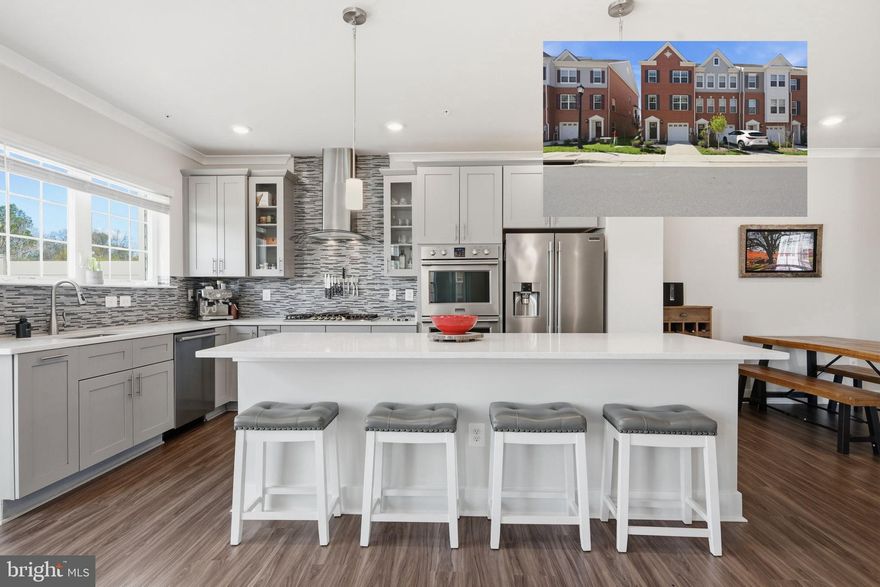 Welcome to your new low-stress, maintenance-free lifestyle. This energy-efficient LEED Gold home, a coveted end unit with a bay window and pond view in the Blue Stream community in Howard County, presents a contemporary floor plan that begins with a mudroom and flex space (gym, home office, future bedroom, etc.) on the ground floor with a walk-out to the backyard. On the next floor, a contemporary kitchen with crown molding, granite countertops, and high-end Frigidaire Professional stainless steel appliances (including double oven) intersects with an elevated deck, reading space, dining area, and spacious living/family room. Next, the primary bedroom offers cathedral ceilings, walk-in closet, and bathroom with oversized shower and soaking tub (and special garnet-bearing granite countertops). Two other well-sized bedrooms with ceiling fans share the floor. A fourth floor loft could serve as a massive office, game room, or additional bedroom with access to a roof deck, providing entertainment space and immaculate views of the pond and local wildlife. Dual zone climate control, tankless water heater (you'll never run out of hot water), bathrooms on every floor (5 total), LED lighting, and luxury vinyl plank and professionally-cleaned carpet throughout add to the rich amenities available in this home. Built in 2022, everything in this house is still new, offering peace of mind for years to come. The community center offers a beautiful pool with an outdoor grilling area, gym with free weights and cardio equipment, and meeting space. The neighborhood has multiple playgrounds, walking path around the pond, local dog park, and highly rated Howard County public schools.