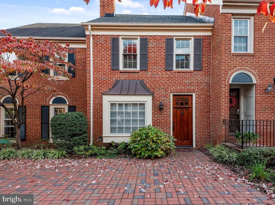 TASTEFULLY RENOVATED, North Old Town, brick townhouse tucked into a quiet, off-street Nethergate spot.  Step through the striking, custom-built, 10-foot, wood Pella front door into the living room, featuring: hard wood floors, a bay window with seat, and built-in shelving that surrounds a cozy wood-burning fireplace. Here, a conveniently located half bathroom, perfect for your guests, has been renovated with glass and marble wall and floor tiles, plus a custom sink and faucet.  * *  Everything you are looking for will be found in the custom-designed kitchen with:  ceiling height, wood, wall cabinets; raised counter bar; and gorgeous stone tile flooring.  Enjoy the beautiful granite countertops tops with glass backsplash and under cabinet lighting that provides a well-lit work surface and cozy evening light.  A stainless steel, GE appliance package and beverage cooler completes this fabulous kitchen.  The stone tiles continue to the dining space, which features a brick accent wall and wall-mounted TV that conveys. New french-style, sliding glass doors open to a large, private patio.  Step outside to enjoy this wonderful, stone patio that offers a setting for lounges, fire pits, and grills to entertain or just relax.  * *  Upstairs you will find two bedrooms, both recently painted and feature hardwood flooring and recessed lighting.  The primary bedroom features a vaulted ceiling and two closets.  Enjoy the stunning renovated, full bathroom with a walk-in shower finished with high-end tile, pebble flooring, glass doors and upgraded shower head combo. Enjoy the convenience of a brand new stacked washer and dryer on this bedroom level. * *  TRULY MOVE-IN READY.  All systems replaced for your peace of mind: new HVAC system in 2015,  electric hot water heater in 2020, new washer and dryer in 2021,  new roof featuring architectural shingles in 2021, and recessed lighting has been installed in every room.  The two wall-mounted TVs convey with the property, plus window coverings throughout, including cordless cellular shades.  (All furnishing negotiable in a separate bill of sale)  * * 
LOCATION.  Located in a super, desirable north Old Town Alexandria neighborhood, minutes to: Old Town/King Street restaurants, shops and riverfront, Del Ray, Crystal City, the Pentagon, Amazon HQ2, downtown DC, and DCA.  Plus, minutes to the Braddock Metro and future Potomac Yard Metro stop.   * * PARKING.  Off-street, resident-only parking lot for registered vehicles, and ample street parking for both residents and guests.  This is a must see, one-of-a kind, move-in ready home!  Don't miss it!