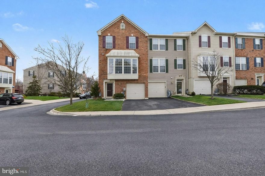 Nestled in the charming Perry Hall Farms Community, this delightful end-of-group townhouse offers a perfect blend of comfort and community. This Colonial-style home boasts, new carpet, freshly painted walls and ceilings, 2,198 square feet of well-maintained living space, featuring three spacious bedrooms and two and a half bathrooms. The inviting layout is enhanced by a cozy fireplace, perfect for creating warm memories during chilly evenings. The community thrives on a spirit of togetherness, with well-kept grounds that include snow removal, lawn maintenance, water, and trash services, allowing you to enjoy your surroundings without the hassle. While there are no community amenities, the neighborhood itself is rich with local parks and green spaces, ideal for leisurely strolls or weekend picnics. The area is also well-served by public services, making daily life convenient and stress-free. With an attached garage and driveway parking, this home offers both practicality and ease. The exterior features a charming blend of brick and vinyl siding, providing a classic look that complements the neighborhood's aesthetic.  Relax on the newer maintenance free composite deck with vinyl rails.  Experience the warmth of community living in this lovely townhouse, where comfort meets convenience in a vibrant setting.  Other improvements include Roof(2018), 2nd level flooring(2023), HVAC(2022), Garbage disposal(2025), Sump pump(2024), Water Heater(2022), Washer and Gas Dryer(2020) and Driveway replaced and resealed(2024).  No worries, 1 yr home warranty included with sale! Your new home awaits!