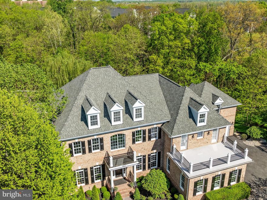 One of a kind opportunity in the sought after Highlands section of Lansdowne!  This gorgeous home boasts over 8,000 sq feet of finished living space, plus top of the line outdoor living which includes a Pavilion with wood burning fireplace, outdoor kitchen, multiple patios, a large deck overlooking the woods & creek, a putting green and a hot tub! The extensive hardscape and landscaping creates your own private Oasis!  This home also features very hard to find finished living space above the detached garage w/ a full bathroom.  Guest Suite, Home Office, In law Suite.... you choose!  All of this plus an ideal location at the end of the culdesac, backing to woods, and an easy stroll to the River & Potomac Heritage Trail. Plus easy access to the Potomac Club featuring indoor & outdoor pools, fitness center, game room, playground & more!  Not to mention Quick access (stairs off of Squirrel Ridge) to the Golf Club and Lansdowne Resort.  Enjoy this wonderful floor plan which features front & back stairs, main level Study/Office, Spacious Mud Room, Butlers Pantry & much more on the main level.  The upper level boasts an expansive Owners Suite, complete with its own upper level deck, and 3 spacious secondary Bedrooms (Jack & Jill suite, Princess Suite).  The walk-out Lower Level features another Bedroom (not legal), a full bath with a steam shower, a massive recreation room with the ability to create multiple living spaces, a large Bonus/Media Room, and a home gym!  All of this AND it feeds into the coveted Belmont Ridge Middle & Riverside High Schools.   Roof and all 3 HVAC systems replaced within last 4 years.