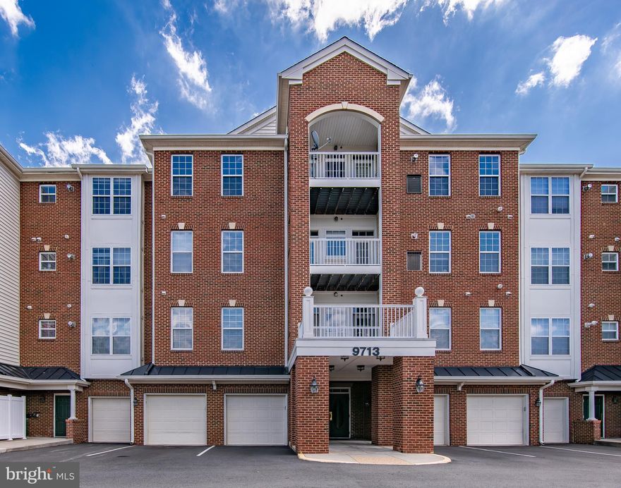 Beautiful sun‑filled top‑floor corner unit with a HUGE balcony! Extra windows flood the open layout with natural light. This spacious home includes a one‑car garage with driveway, two large bedrooms, two full baths, and separate living and dining rooms with luxury plank flooring. A dedicated laundry room offers a full‑size washer and dryer. The kitchen has tile floors, stainless steel appliances, granite countertops, a center island, and abundant cabinet space ideal for cooking and entertaining. The primary suite features a custom walk‑in closet and a spa‑like bath with soaking tub, dual vanities, and separate shower. The second bedroom is generously sized and includes a Murphy bed with built‑in bookshelves.
Located in Manassas Park’s booming Park Central district—walk to the VRE, new civic buildings, shops, dining, parks, and the upcoming B&B Theatres luxury entertainment complex. A perfect blend of comfort and convenience.