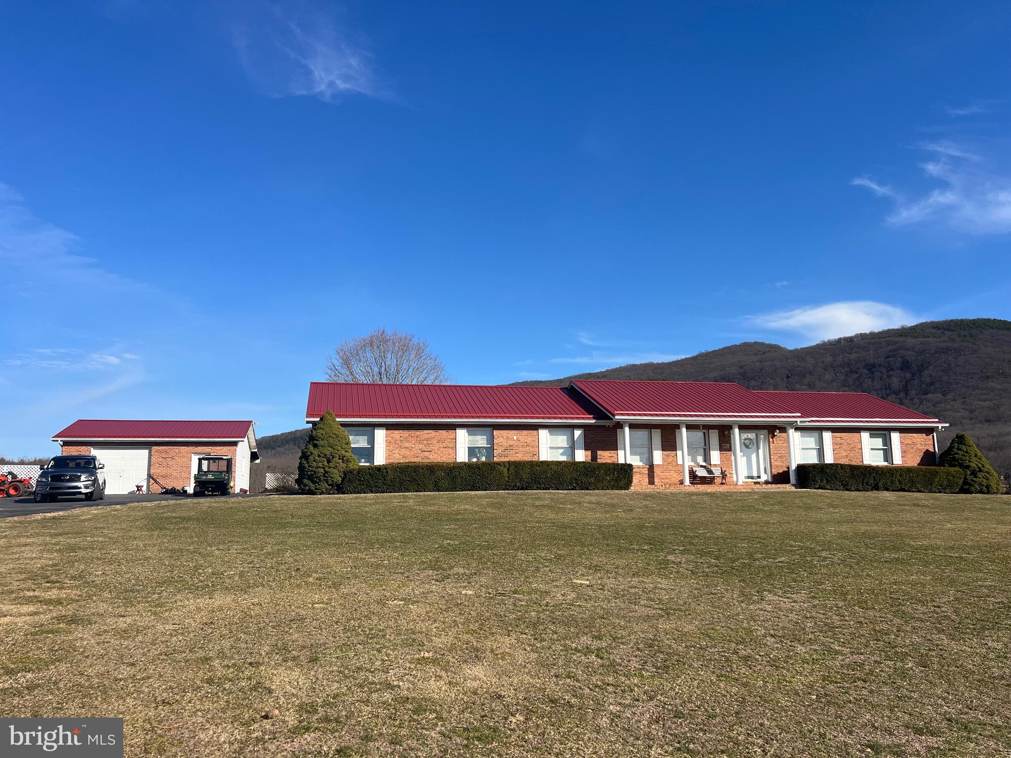 REDUCED! Beautiful, one-level, brick home on four hill top acres in Potomac Valley View with direct access to the golf course! With panoramic, breathtaking sunset views, this brick home with new metal roof, means low maintenance and more time to enjoy the views from the front porch! Centrally located between Moorefield and Petersburg, included is an attached two-car and detached one car garage/workshop. What a place to retire to or raise kids! Public water, fiber optic, electric, private septic, outdoor wood stove if you choose to use. So many amenities in this beautiful neighborhood that is a close drive to Smoke Hole for trout fishing, Canaan Valley for skiing, biking and hiking, South Branch of the Potomac River for water fun and National Forest for more outdoor adventures! And did I mention you can drive your golf cart from house to the magnificent 18 hole Potomac Valley View Golf Course?! Get pre-qualified and schedule and appointment to view this beautiful home today! More pics coming soon!