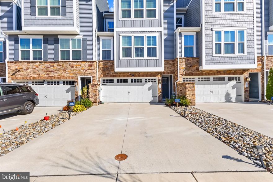 Welcome to 116 Torrey Dr in the highly sought after Village at Pine View, a beautifully crafted three level interior townhome offering style, comfort, and impressive modern upgrades throughout. The entry level features a spacious two car garage, a private fourth bedroom ideal for guests or extended living, and a convenient half bathroom. The main level showcases a true open concept design that seamlessly connects the gourmet kitchen, dining area, and family room, creating an ideal setting for gatherings and everyday living. The kitchen features granite countertops, large cabinets, a generous island, and access to a stunning deck that includes its own outdoor fireplace for year round enjoyment. This level also includes a well placed half bathroom for guests. The upper level offers three well appointed bedrooms, including a serene main bedroom with a spacious walk in closet and a private full bathroom. A second full bathroom is accessible from the hallway, and the laundry area is thoughtfully located on this level for added convenience. Newark offers unparalleled access to the Christiana Mall for tax free shopping, as well as quick connectivity to i95 leading south toward Baltimore and Washington DC or north to Philadelphia and the Philadelphia airport. Residents also enjoy the option of traveling south on Route 1 to reach the Delaware beaches. This exceptional home delivers grand living, modern finishes, and an unbeatable location.