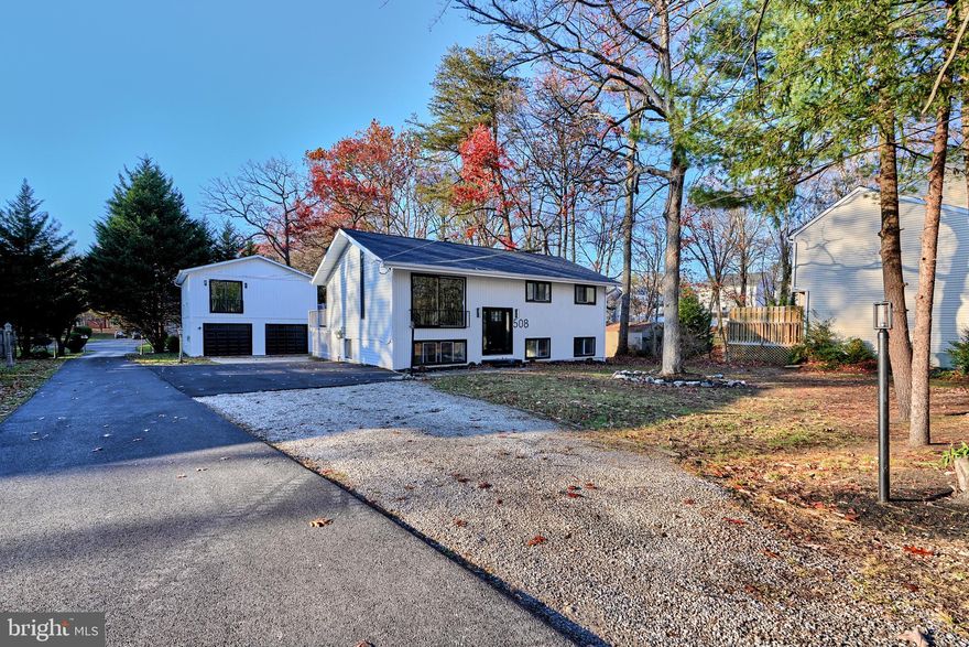 Discover this stunning split-foyer home, reimagined for luxurious living in the heart of Severna Park. This 5-bedroom, 3-bathroom residence is a true gem, showcasing exquisite upgrades and thoughtful design throughout. Step into a sunlit main level adorned with gorgeous marble accents, where every detail has been meticulously curated for style and comfort. The open-concept living and dining areas flow seamlessly to a sprawling back deck, ideal for entertaining or quiet evenings overlooking the serene backyard. The chef’s kitchen features top-of-the-line appliances, custom cabinetry, and premium finishes, ensuring every meal is an experience.

Retreat to the primary suite, an oasis of tranquility with spa-like amenities. The fully finished lower level offers additional bedrooms, a full bath, and a versatile space perfect for a home theater or gym.

As a bonus, this property includes a legally zoned, separately metered 2-bedroom, 1-bathroom garage apartment—a private haven with its own entrance. Whether used as an in-law suite, guest quarters, or income-generating rental, this beautifully updated space mirrors the home’s high-end aesthetic.

Located on a quiet street with no HOA and boasting top-rated Anne Arundel County schools, 508 St. Martins Lane offers unmatched elegance and versatility. Experience a home where luxury meets lifestyle—schedule your private tour today!