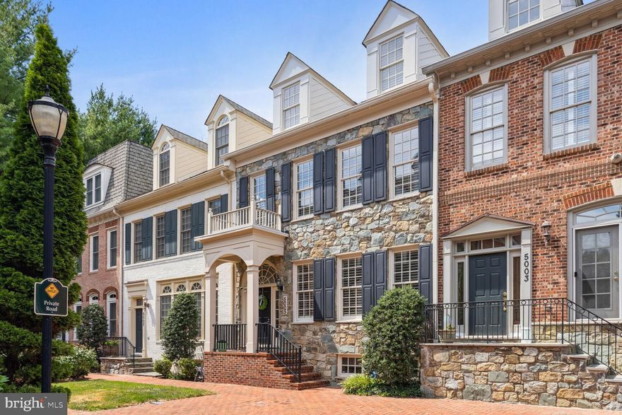 Welcome to your dream home in the prestigious Bethesda Crest neighborhood. This luxurious stone-front townhome boasts four meticulously finished levels, offering an unparalleled living experience.

As you step through the stately foyer, you're greeted by gleaming hardwood floors that stretch across the main level. The elegant living room at the front of the home seamlessly flows into the formal dining room, adorned with classic wainscoting—perfect for entertaining guests.

At the rear, the gourmet kitchen is a chef's delight, featuring granite countertops and stainless steel professional-grade appliances. Adjacent to the kitchen, the family room provides a cozy space for relaxation. A conveniently located powder room completes this level.

The upstairs primary bedroom is a serene retreat, highlighted by a tray ceiling and recessed lighting. The expansive ensuite bath offers a luxurious escape with a separate tub, a glass-encased shower, dual vanities, and a spacious walk-in closet with built-in shelving. Two additional bedrooms and another full bath provide ample space for family or guests.

The second upper level hosts an additional bedroom and a full bath, perfect for a private guest suite or home office.

The lower level is designed for comfort and recreation, featuring wall-to-wall carpeting, a large recreation area, another bedroom, and a full bath.

Step outside to the rear brick terrace, a charming spot for outdoor dining or relaxation, accessible directly from the kitchen. The home also includes a 2-car rear-loading garage for your convenience.

Located just off Wisconsin Ave, this townhome offers easy access to NIH, 495, and all the amenities Bethesda has to offer. Don't miss the opportunity to call this exquisite property your home.