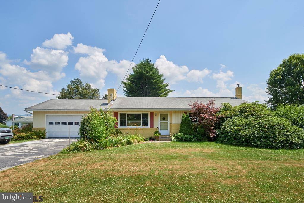 This well-maintained Centre Hall charmer has so much to offer. From the outside the ranch home is framed by lush landscaping welcoming you in from the road. The back yard boasts bountiful gardens that can be enjoyed from the deck or the 4 seasons porch. SELLER IS INCLUDING A JOHN DEERE RIDING MOWER AS PART OF SALE. When you walk in you will see that the home flows nicely from one room to the next. The large living room leads into the spacious eat in kitchen which leads you into the formal dining room. Down the hall is the master bedroom with connected 1/2 bath, 2 nicely sized guest rooms, & a full bath. The home also has a large family room in the basement with a wood burning stove perfect for those winter nights. The basement also has a bonus room that could be used for a variety of purposes. The home features a mini split system & new hardwood floors.