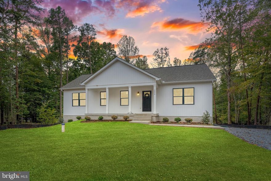 WARM WISHES AND BIG SAVINGS!      Scan the QR Code for current incentives! 
Welcome to Wyndemere!
This newly completed 5-bedroom, 3-bathroom Rambler sits on a full acre in the prestigious Wyndemere Subdivision at Lake Anna, offering exclusive water access and a lifestyle of both elegance and leisure.
Inside, the open-concept floor plan is filled with natural light and enhanced by vaulted ceilings with stained wood beams that add warmth and rustic sophistication. The chef’s kitchen boasts granite countertops, stainless steel appliances, a farmhouse sink, and direct access to an expansive deck—perfect for entertaining or enjoying peaceful mornings overlooking your private backyard oasis. Gleaming hardwood floors carry throughout the main level, while bathrooms are finished with custom tile and thoughtful details, including a spa-like freestanding soaking tub.
The finished basement provides remarkable versatility with an additional bedroom, full bath, office/bedroom, and a spacious recreation room ideal for gatherings. With approximately 2,800 square feet of meticulously designed living space, this home offers both comfort and flexibility.
Set on a beautiful large useable lot, the property provides privacy, ample outdoor space, and room for future expansion or personalized outdoor living. All within the sought-after Wyndemere community, where residents enjoy water access to Lake Anna, a relaxed yet refined lifestyle, and year-round recreation.
This brand-new Rambler is the perfect blend of timeless beauty and modern convenience—ready for you to call home.