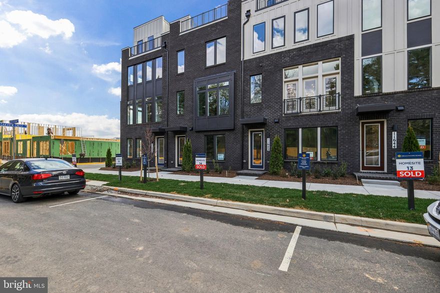 Introducing Sunset Station — a collection of newly constructed luxury townhomes in the vibrant heart of Reston, Virginia, by Dream Finders Homes, nationally recognized as 2025 Builder of the Year. These townhomes set a new standard in sophisticated design, outstanding quality, and lifestyle-focused living. Located within Reston’s American Dream Way neighborhood, Sunset Station offers easy access to Reston Town Center, Metro stations,  W& OD Trail, community parks, shopping, and transit options.
The neighborhood is being developed with walking paths, landscaped outdoor spaces, trails, and amenities to foster a true neighborhood feel.  It is truly a one-of-a-kind oasis!
(Homesite 15) This home is currently under construction, and will be ready in January.  Interior 3-level Whitman model, featuring a Rec Room & Powder Room on the entry level, and 2-car garage in the rear.  Oak staircase leading to the main level, welcoming you into the open & airy floorplan with 10’ ceilings and full length casement windows.  This kitchen boasts an oversized center island with Waterfall quartz countertops, large sink and Kohler fixtures.  Whirlpool Premier package appliances with hood vent, Gas cooktop, built in microwave and wall oven is every chef’s dream.  Rich espresso colored cabinetry throughout, including a coffee bar next to pantry.  Great Room with electric fireplace, looking out onto the Sky Lanai which is the covered outdoor living space. Upper level is constructed with 3 bedrooms and laundry room.  The Primary Suite is truly a private retreat, with dual walk-in closets and large seated shower.