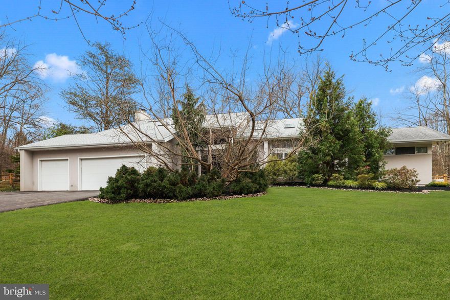 Beautiful, Private and Secluded!!! This 4 Bedroom / 4.5 Bathroom Contemporary style home situated on 10 acres.  Long meandering driveway off private road in exceptional section of Upper Makefield Township and Council Rock School District.  Ultimate First floor Master Bedroom addition with vaulted ceiling, so many windows overlooking backyard with beautiful vistas, dedicated deck, his/hers oversized walk-in closet, and a drop-dead Master bathroom resembling a spa with marble floors and surround, walk-in shower and floating double vanity. Enter foyer and immediately visualize the open floor plan, vaulted ceilings, floor to ceiling windows, additional skylights and wide-plank flooring. Main level consists of Living room, formal dining room, kitchen with breakfast area, granite counters, stainless appliances, family room with wood burning fireplace and built-in wet bar, laundry room and powder room.  Sliding glass doors off kitchen area to backyard oasis. Upstairs is second primary bedroom with cozy fireplace, its own bathroom, sitting room, and large walk-in closets.  Two additional bedrooms and full bathroom. Professionally landscaped grounds, heated swimming pool with large deck surround, and fun pool shack. Newer Roof, newer furnace, appliances, newer split-rail fence, whole house generator, and security cameras.  Three car-garage.