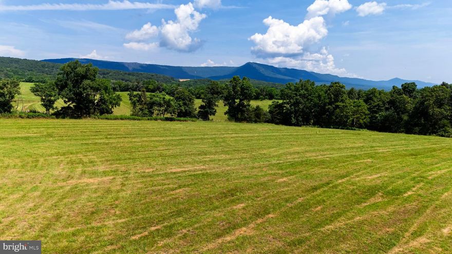 Seller financing available! Embrace the best of country living with this breathtaking 12.20-acre farmette showcasing sweeping, panoramic views of the Shenandoah National Park and George Washington National Forest. Perfect for the hobby-farm enthusiast, this property offers gently rolling hay fields that stretch toward the mountains, creating an ever-changing landscape of light and color throughout the seasons. The mostly open acreage provides endless possibilities—whether you envision pastures for horses or livestock, fertile ground for crops, or simply a serene countryside retreat surrounded by natural beauty. With no HOA and eligibility for the land use real estate tax reduction program, you will enjoy the freedom to live and farm your way while keeping ownership costs low. Located just minutes from Stanley, Virginia, and within easy reach of two public boat landings on the Shenandoah River, this property combines tranquility and adventure in one exceptional setting. From sunrise over the Blue Ridge Mountain peaks to sunsets casting golden light across the fields, this is your opportunity to own a piece of the Shenandoah Valley’s most captivating views—made even more attainable with flexible seller financing.