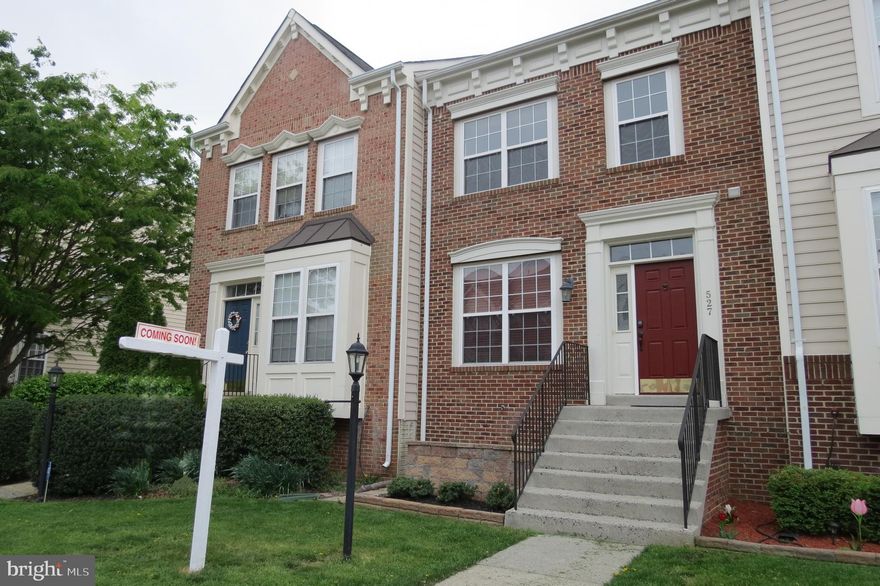 Welcome home!  Back on the market, staged and ready for its debut.  This beautiful three-level brick front townhome in sought-after Potomac Station has been lovingly cared for by its present owners.  With nearly 2200 square feet, there is generous living space throughout.   Upon entering the home, you will be greeted with hardwood floors which run the entire first floor level.  Fresh two-tone paint draws the eye to the crown moldings and chair moldings.  The kitchen boasts granite counters and stainless appliances, and best of all for the gourmand in the family, there is gas cooking.  A built-in microwave, island and corner pantry add still more convenience to an already well laid out kitchen.  Just off the kitchen is a cozy breakfast nook and a back door which opens to a broad custom deck with lighted rails overlooking common area.  The new carpet on the levels up and down is sure to please.  The primary suite is an oasis after a long day.  The vaulted ceilings add dimension to the large room and a walk-in closet has closet organizers.  The primary bath has been beautifully updated with a huge walk-in shower.   The tiny cubby that once housed the old shower is now added storage space in the form of a linen closet.   Two more bedrooms complete this level as well as a hall bath.  Pull-down stairs make storing those less often used items convenient.  The lower level is light and bright.  A generous room has been used as a home office, but could easily double as a fourth bedroom.  The family room welcomes all to its comfort with its gas fireplace for those chilly evenings.  The washer and dryer were replaced in 2016 and a second powder room complete this level.  The fenced yard is accessed through a door off the family room.  The utility room houses an upgraded Carrier 17 Seer heating and air conditioning system ($10K system) with Smart thermostat replaced in 2017.  The water heater was replaced in 2020.  This house is a "must see" which is close to major roads and shops.  And, it's just waiting for its next loving owners - YOU!