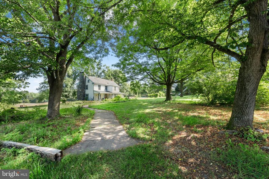 Set in the center of 90 UNPRESEVERED acres amongst fertile rural lands in an area seemingly untouched by modern time, Cairnson Farm, is one of a few pristine unaltered Bucks County farms that still remain and is available for the first time in approximately 50 years. Own everything you overlook…rolling pastures and mature forest for exploring and watching wildlife. Here a collection of buildings will spark dreams and opportunities. A circa 1800s home with wood floors and beamed ceiling rests in a setting that warrants restoration and expansion or use this home as a guest house and build a modern masterpiece on the highest point with long distance views of the majestic Delaware River.
A large barn building, previously used as a brewery, offers a versatile space for housing collections, equipment, projects and workspace. With a 4 story lookout, massive beams framing high ceilings and open spaces, concrete floors, electric, lighting and full bath, the cost to replicate this building would be considerable.  An antique stone and frame bank barn is a classic piece of history and also offers room for equipment and collections.
With no restrictions the acreage is a refuge and a delight, offering a showcase of views and a symphony of silence where everyday, every season, presents a new opportunity to enjoy the pleasure of an unspoiled oasis in the middle of an oft too civilized world.  Its country location is convenient to shopping, restaurants and entertainment and is the perfect weekend getaway from New York City and Philadelphia.  
An adjacent c.1890s home on 3 acres is included and would be perfect for a caretaker, rental, or extended family.   The interior of the home is as charming as the exterior featuring a living room with wood floors, decorative fireplace and beamed ceilings.  A white eat-in kitchen with exposed beams and glass door overlooks the deck, lawns and forest beyond.  Two bedrooms with wood floors and a bath with classic fixtures are found on the 2nd floor.  A walk-up attic offers future expansion room.   Steps away from the home a whimsical building is a bonus space with its wood floors, high ceilings with beams and abundant windows.  This versatile building is perfect for a studio, workshop and office.  A single car garage will accommodate a vehicle, toys and equipment.  The abundant acreage is bucolic and offers a fenced vegetable garden, woodland to explore and plenty of area for pets and people to play.