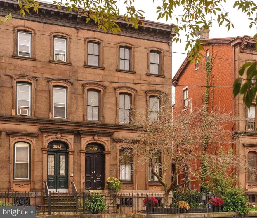 Introducing Cambridge House, a rare 22-foot-wide historic brownstone masterfully restored for modern living. Originally designed in 1868 as the private mansion of Charles Psotta of the Bergdoll & Psotta City Park Brewery, this architectural gem stands among a distinguished row of four grand brownstones once owned by Philadelphia’s famed beer barons.

Soaring 13-foot ceilings, original architectural embellishments, and extraordinary proportions define the home’s timeless grandeur. The Townhouse (Unit A) offers approximately 3,600 square feet of impeccably refurbished living space, plus an additional 1,500-square-foot basement with 9-foot ceilings framed by striking exposed white brick arches.

The entire second floor is dedicated to living and entertaining on an impressive scale. A grand formal living room flows seamlessly into an intimate den, while the sleek eat-in kitchen—appointed with Bertazzoni appliances—opens to a formal dining room featuring a custom wet bar worthy of the most discerning host. A private outdoor deck completes the level.

Upstairs, the third floor offers three well-proportioned bedrooms, including a spectacular primary suite with a spa-like wet room, double shower, and an oversized walk-in closet rarely found in city living. A full bath and conveniently relocated laundry room complete this floor. The top level presents a spacious fourth bedroom with flexible open space ideal for a home office, creative studio, or private guest retreat.

The expansive lower level, currently outfitted as a home gym and storage area, provides exceptional ceiling height and the opportunity to create additional finished living space.

As an added convenience, the seller will provide one year of prepaid parking at a private covered garage located just three homes away.

The home is located in the Fairmount neighborhood of Philadelphia, which boasts delicious eateries and independent boutiques. Nestled in the heart of the Art Museum Area, Fairmount offers a sophisticated blend of historic charm and urban culture just steps from the Philadelphia Museum of Art and the Barnes Foundation. Enjoy direct proximity to the sprawling trails and scenic waterfront of Fairmount Park.

This property is a rare offering where historic significance meets contemporary luxury.