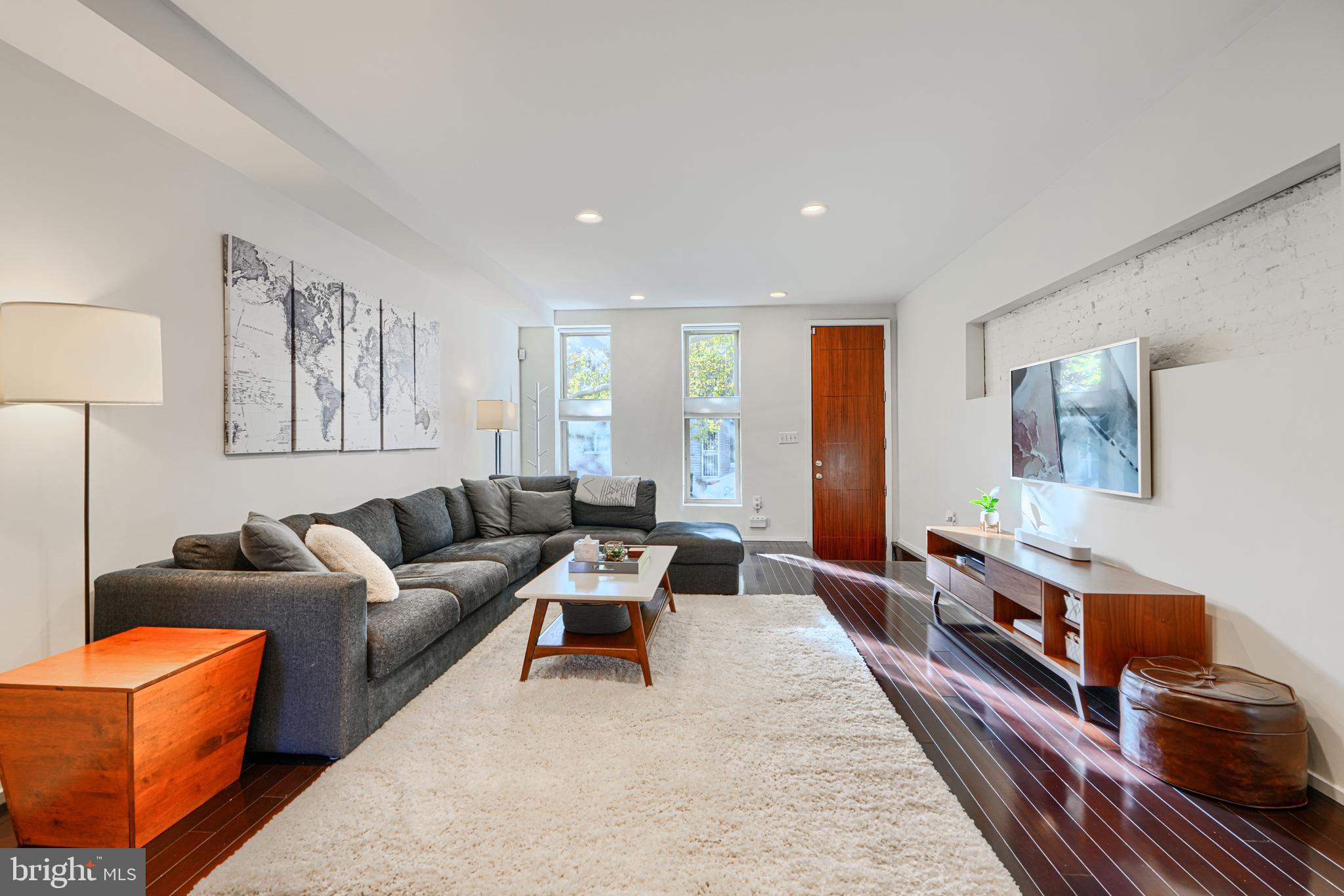 Uniquely modern home in the heart of Butchers Hill/Upper Fells Point. A rare find amongst the traditional Baltimore row homes, this custom renovation, doesn't disappoint. Custom lighting, open stairs, and architectural details throughout combine seamlessly with high end materials and finishes. Enjoy 2 bedrooms with en-suite baths, and an additional open concept bedroom on the third level. The third level can easily double as entertaining space, complete with wet bar, full bath, office area, and access to multiple decks with beautiful water views. The main level boasts a chef inspired galley kitchen, formal dining room, living room, breakfast nook, mudroom, and half bath. The lower level offers additional finished space for family room, exercise area, or additional bedroom, and storage. Not to be overlooked is two car dedicated (tandem) parking! Recent upgrades include HVAC 2023, Numerous appliances 2023, Carpet 2025. Great proximity to JHH, 95, 895, and fabulous dining options.
