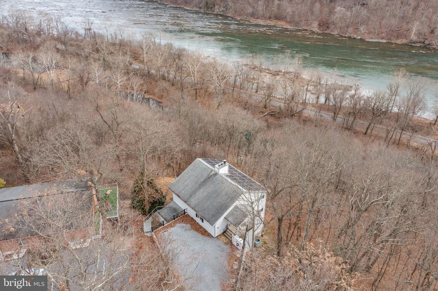 THE VIEW!

$112K–$119K/YR INCOME + FULLY TURNKEY AIRBNB + BEST VIEWS IN HARPERS FERRY

Arguably one of the best river views in Harpers Ferry, this 3-story contemporary home overlooking the Shenandoah River delivers both stunning scenery and proven income.

This fully furnished, turnkey property has generated approximately $390,000 in gross revenue since late 2022, with consistent annual income of $112K–$119K, making it an exceptional opportunity for investors or second-home buyers.

Featuring 3,700+ sq ft, 4 bedrooms, and 3 full baths, the home is designed for large groups and strong rental demand. A private in-home elevator provides convenient access to all three levels, adding comfort, accessibility, and long-term value.

Amenities include a hot tub, fire pit, sauna, billiards table, air hockey, foosball, multiple decks, and panoramic river views from every level.

Solar panels significantly reduce operating costs, with electric bills reported as low as approximately $5/month during summer months.

Open-concept main level with full kitchen and balcony, multiple king suites, bunk room, and lower-level entertainment space with kitchenette.

All furnishings convey — start earning immediately.

Rare combination of lifestyle + income + low operating costs + accessibility, just minutes from Harpers Ferry attractions, hiking, and river access.

Financials and rental history available upon request.