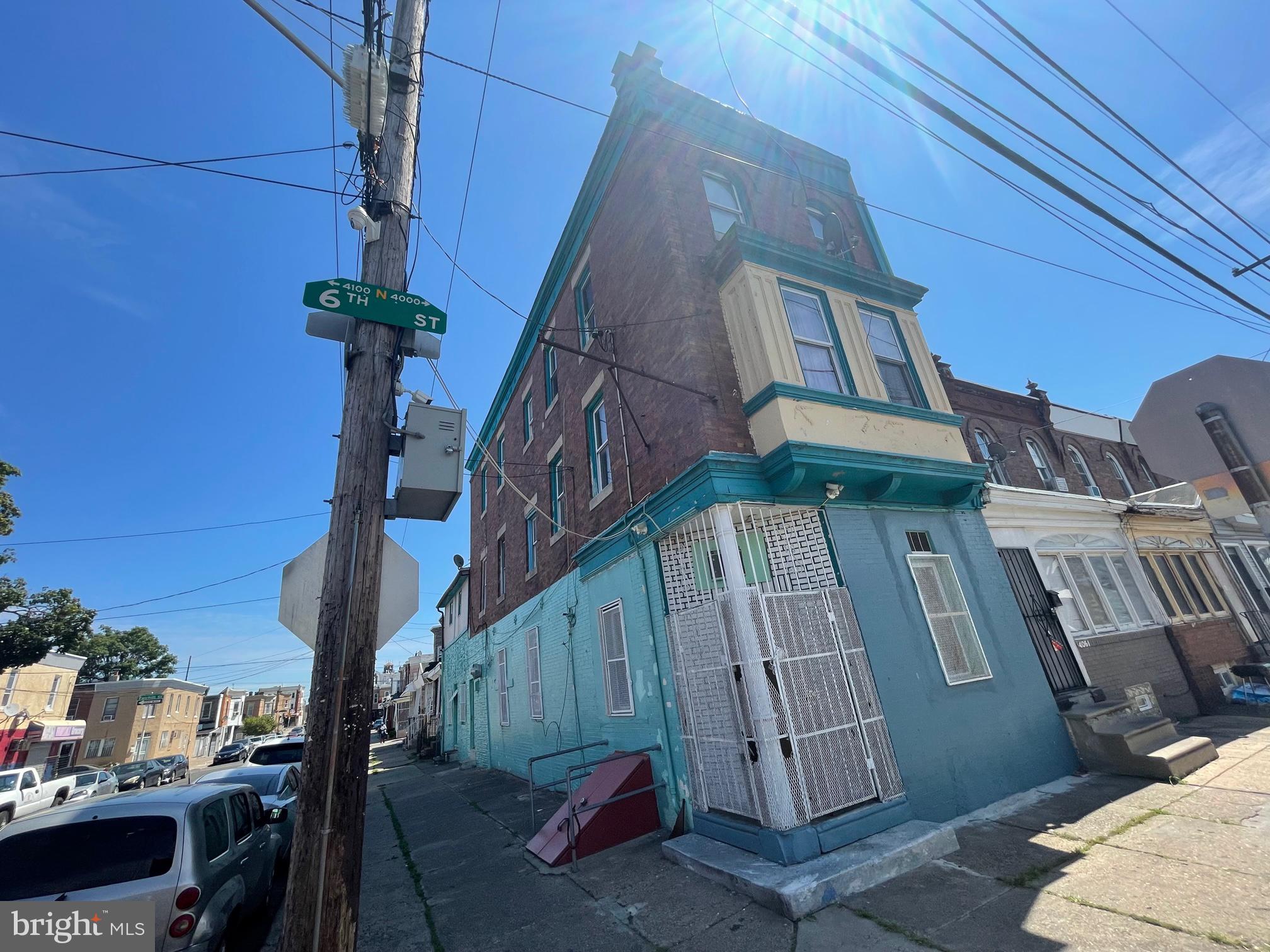 Large corner building currently set up as a 5 apartment building. Separate electrical panels on each floor. Needs extensive work but has lots of potential.