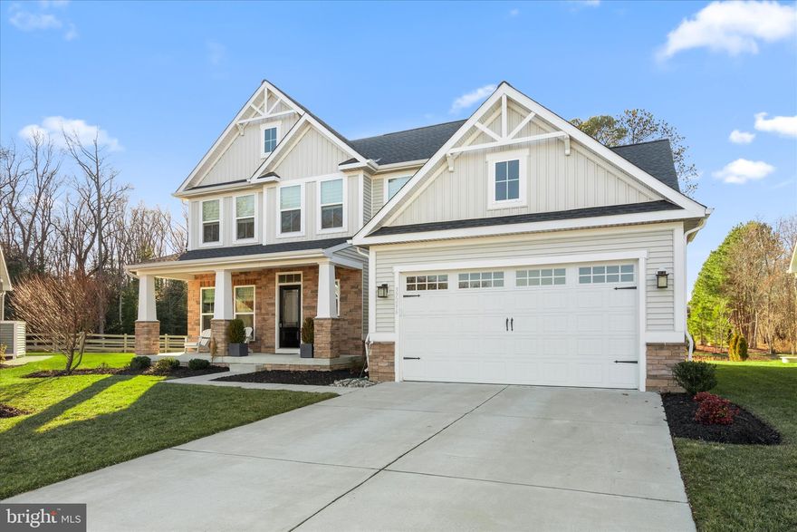 Welcome to this coastal contemporary five bedroom, three and a half bath home is ideally situated on a premium lot within a partial cul-de-sac and showcases the Esquire Place model by Ryan Homes. Designed with the vision of a fully upgraded model home, the seller selected every available enhancement, creating a residence that feels both refined and thoughtfully curated from the moment you arrive.

Well maintained, newer construction home with the builder punch list already completed, this residence is truly move-in ready and offers the rare opportunity to enjoy new construction without the wait. A welcoming front porch invites you to slow down and enjoy quiet mornings with coffee in hand, while inside, luxury vinyl plank flooring and a soft, light neutral color palette set a bright and elegant tone throughout the main level. Just off the foyer, a flexible room with French atrium doors offers the versatility to serve as a home office, guest space, or additional bedroom.

The heart of the home opens into a spacious and airy kitchen, dining, and living area designed for both everyday living and entertaining. The living room is highlighted by a beautifully detailed coffered ceiling, while the kitchen features a large quartz topped island, white cabinetry, stainless steel appliances, a stylish tile backsplash, and a generous walk-in pantry. The adjacent dining area enjoys peaceful views of the backyard, creating a serene setting for meals and gatherings. Throughout the home, high end custom window treatments add both style and function.

The main level primary suite offers comfort and privacy, complete with two walk-in closets and a spa-like en suite bath featuring a dual vanity, linen closet, and an oversized shower. Upstairs, a second primary suite provides an ideal retreat for guests or multigenerational living, with its own private bath and walk-in closet. Two additional bedrooms share a well-appointed hall bath, and a spacious loft offers flexible space for a family room, media area, or playroom.

Additional highlights include an attached two car garage and a widened driveway that provides ample parking for residents and guests alike. HOA provided lawn care and an irrigation system allow you to enjoy a beautifully maintained yard with minimal effort. The home is located within a vibrant community offering amenities such as a pool with a large deck area, pickleball courts, a community center with fitness facilities, and a welcoming fire pit area for gathering with neighbors, all less than six miles from the Bethany Beach boardwalk, shops, and restaurants.

This home is being offered partially furnished, with a detailed list of included furnishings to be provided.