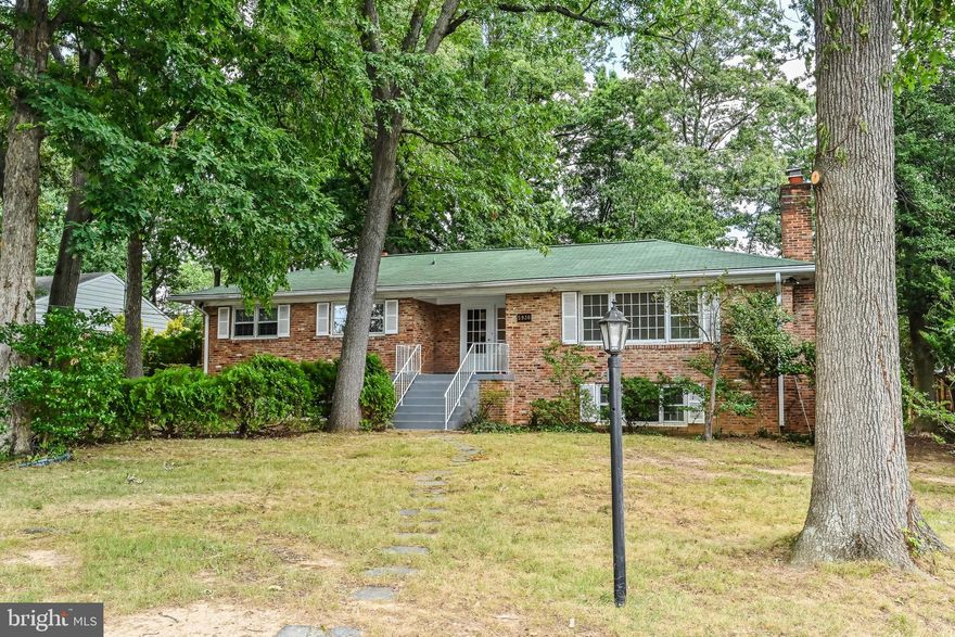 Sold AS IS.  Great opportunity to make this house your own.  Needs some work and is priced accordingly.  Move in and update gradually or totally renovate.    Solidly built brick home.   Hardwood floors on main level.  Spacious Living Room with fireplace.  Separate formal Dining Room.  Access to backyard from Kitchen.  Lower level has a huge Rec Room with a fireplace and a built in bar plus a 4th Bedroom and full bath.  Large storage areas.  Just under a half acre flat yard.  Detached garage in backyard.  Roof and AC replaced approximately 5 years ago.  Convenient close in location.  County park with playground just a few blocks away.  Close to all commuting routes, shops and restaurants.