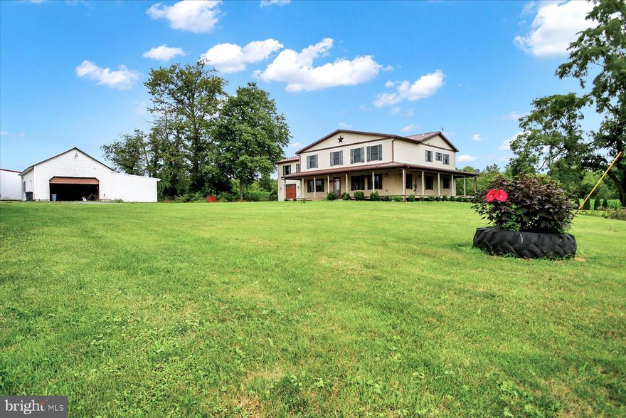 Private 70 acre estate with 4500 sf home,  PA bank barn and two large pole buildings.    Several stables in barn, fenced pastures.    House features newer addition with approx 4500 sf of living area with exposed log and stone walls from original farm house.   Large 30x34 great room opens to 32x16 deck overlooking fields and woods.    Outbuildings include 30 x 60 pole building with wagon sheds on each side,  20 x 42 garage with wagon sheds,  water and electric to buildings.   Small stream borders property.   If you're looking for privacy with no visible neighbors you've found it here.