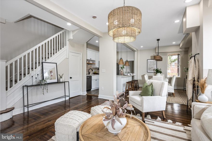 Great renovation by Art Of Living & Design.  Everything is new including all systems and mechanicals. rear deck, parking pad can accommodate 2-3 cars. all wood floor,  end unit with an unusually large yard, fully finished basement with a full bath. Easy to show.