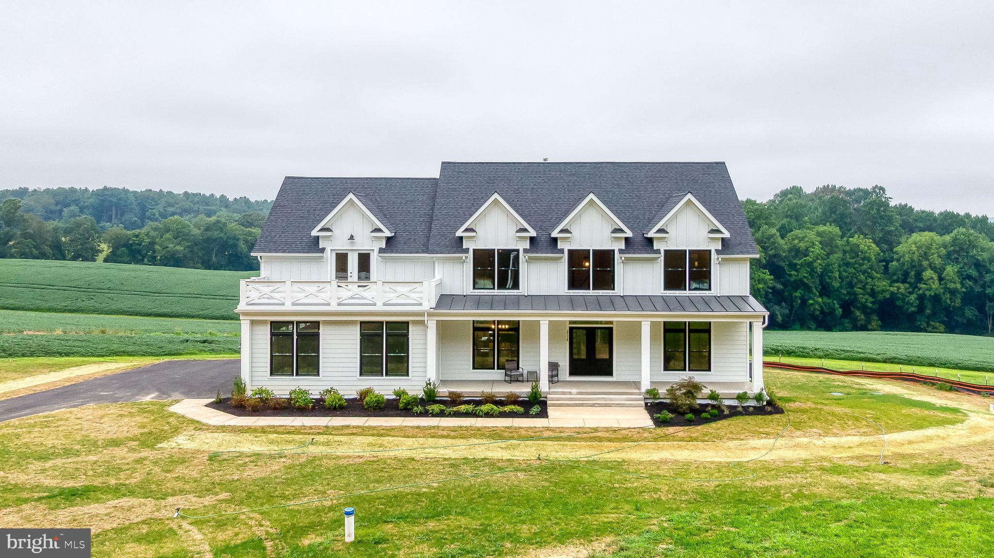 JUST COMPLETED & READY FOR IMMEDIATE MOVE-IN on Beautiful 2 acre homesite with Panoramic Views ! Greenspring Homes Adams 3 Farmhouse Model with designer selected luxury upgrades throughout ! ***DON'T MISS THE BUILDER SPECIAL "AUGUST SUMMER SAVINGS" FOR A LIMITED TIME Choose $ 20,000 in FREE OPTIONS or $ 10,000 CASH at Closing or Interest Rate Buydown - (see flier)***. Gourmet A "Chefs Dream" Kitchen with all the perks including large Walk-in Pantry. Spacious Breakfast Room w/triple slider, Mudroom with custom built-ins, Family-Great Room w/ Box Coffered Ceiling & Gas FP. Formal Dining Room, Main Floor Office & Full Bath. Grand Main Staircase & 2nd convenient rear Staircase. Owners Suite w Private Deck, Luxury Bath w/2 Person WI Shower, Freestanding Soaking Tub & 2 HUGE Walk-in Closets. Convenient 2nd Floor Laundry & 4 additional Bedrooms w/upgraded baths. 3 Car Oversized side load garage with expanded parking pad & more ! There's still time to add finished rec room, theatre/fitness room, covered /screened rear porch . NO HOA! ! BUY NOW & ASK ABOUT THE NO COST REFINANCE for up to 5 YEARS !