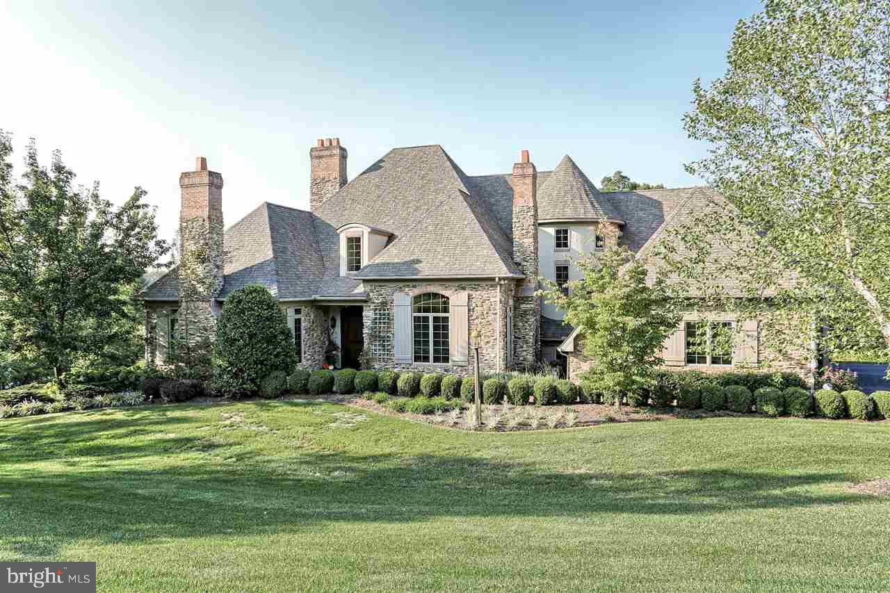 Stunning Custom Designed & Masterfully Crafted Old World Charm w/Modern Amenities. Interior design is reminiscent of a French Manor w/architectural beamed ceilings. The home boasts custom cabinetry & millwork thruout; an open airy living space for entertaining & family living. Exceptional kitchen w/Top Tier Appl, FP & sitting area opening to gracious patios overlooking private yard. First Fl Master Ste, 2nd flr reading loft. Possible in-law Ste.