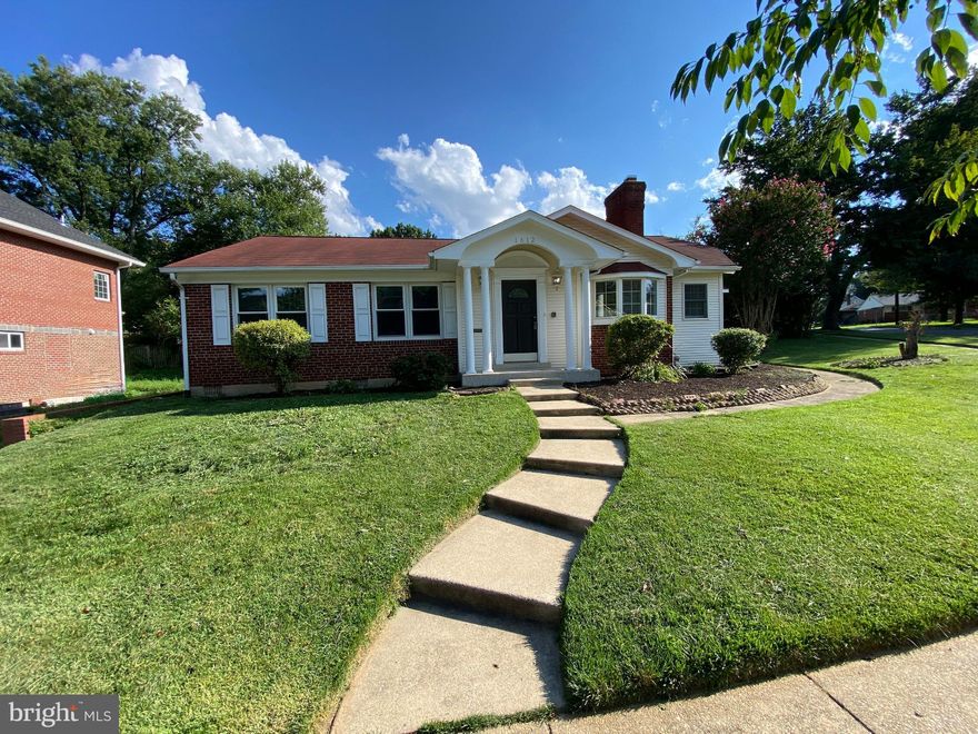 Comfort and convenience in the quiet Woodside Community just minutes from downtown Silver Spring. 4-bedroom 2.5 bath brick home situated on a corner lot. Updated bathrooms, stainless steel kitchen appliances, new windows on main level, hardwood flooring throughout the home, with a fireplace and rear patio. Private entry in the basement for possible rental or in-law suite. This one won't last long.