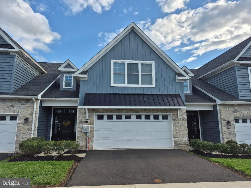 An exceptional opportunity to own a nearly new luxury townhome in an intimate, meticulously maintained 55+ community, just moments from every modern convenience. Welcome to 909 Holden Court, where sophisticated design, premium finishes, and effortless living are seamlessly combined.
Rich engineered hardwood floors grace the main level, beginning in the elegant foyer and flowing into a chef-inspired gourmet kitchen featuring quartz countertops, an expansive center island, and gas cooking—perfect for both everyday living and entertaining. The open-concept living area creates a serene retreat ideal for morning coffee, a private workspace, or relaxed afternoons. Step outside to the adjoining patio and enjoy peaceful outdoor living with minimal maintenance.
The main-level primary suite offers the ultimate in comfort and convenience, featuring two spacious closets and a spa-like en-suite bathroom with a double vanity and marble flooring. Completing the first floor are a refined powder room and a well-appointed laundry room with direct access to the oversized two-car garage.
Upstairs, a striking wood staircase leads to a versatile loft—perfect as a reading lounge, media area, or home office—along with two generously sized bedrooms and a beautifully finished full bathroom, ideal for guests or family visits.
Ideally located near upscale shopping, fine dining, and major transportation routes, this residence offers both tranquility and accessibility. Thoughtfully designed and impeccably maintained, this home represents refined, low-maintenance living at its best. The current owners are relocating to be closer to family, creating a rare opportunity for the next discerning buyer.  
Schedule your private tour today,