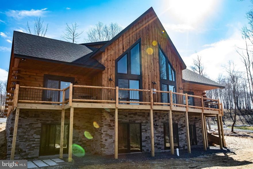 GOLF COURSE living!! Don’t miss out on this custom-built, log-cabin. This beauty was built in 2024 and comes FULLY FURNISHED. With its proximity to Wisp Ski resort, hiking trails and lakes, this home can be enjoyed in all four seasons making it perfect for a vacation or primary home. There are 5 bedrooms, 5 baths and plenty of space for entertainment and recreation. Don’t forget the hot tub and fire-pit. Everything you need is here, come check it out!