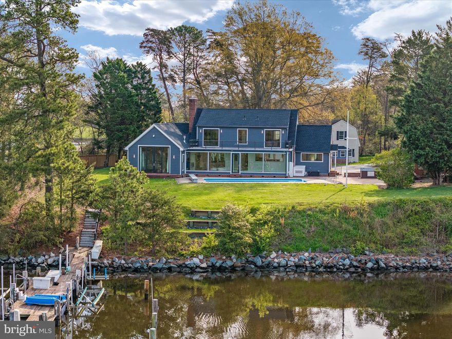 Dock your boat, drop your bags, and start enjoying waterfront living. Completely renovated from top to bottom leaving you with years of maintenance free living. Deep waterfront estate on the Tred Avon River. With natural elevation, flood insurance is not a concern.  Like new construction and move-in ready, this property stands as a testament to unparalleled luxury and meticulous attention to detail. Situated on a private, two-acre peninsula with 910' of pristine shoreline, this stunning home offers a serene haven for those seeking the epitome of comfort and sophistication. As you step inside, prepare to be enveloped by a wealth of high-end upgrades. From heated floors to interior accent lighting, custom fireplaces and stairways, gourmet appliances with custom Amish cabinetry, every detail has been carefully curated to elevate your living experience. The main residence with 3 bedrooms and 5 bathrooms, spans over 3,800 square feet and showcases a master chef’s kitchen equipped with Thermador appliances and meticulously crafted Amish inset cabinets with ingenious storage solutions, including double stacked utensil trays, lower pullout drawers, carefully hidden usb chargers and outlets, spice racks, dish drawers, and canister and knife block pullouts. Natural beauty seamlessly integrates into every room, with breathtaking views of the river serving as a captivating backdrop throughout. The private owner's suite epitomizes elegance, featuring a gas fireplace and a spa-like ensuite complete with an oversized glass tile shower, and heated towel racks. Two walk-in closets offer ample storage space, while the 10' custom Pella sliders, leading to the private patio, provide a tranquil retreat for soaking in the magazine-worthy water views. The open-concept floor plan seamlessly connects the dining area, family room, and living room, creating a welcoming environment for both relaxation and entertainment. Upstairs, two bedrooms with private baths lead to a rooftop deck, offering panoramic views that inspire awe. Recently nominated for an American Institute of Architect award, this residence exudes architectural brilliance. Outside, the property boasts an equally impressive exterior, featuring a private pier with electric, water, boat lifts, floating docks, storage bins, and multiple slips. The 6'+/- MLW ensures suitability for sailboats, powerboats, and water toys alike. The calm of the Tred Avon offers kayaking, paddleboarding, swimming or fishing. The icing on the cake - an inground heated saltwater pool offering breathtaking views of the River. The guest cottage, 1,863 square feet, gives and added layer of charm and offers two bedrooms, one and a half baths, and an attached 2-car garage with an additional 1000 square feet of unfinished storage space. Completely renovated with modern amenities and thoughtful design, the guest cottage provides a perfect retreat for guests or additional space for your lifestyle needs. The property was reconstructed in 2022 from bottom to top and includes, but is not limited to, updates such as all-new Pella windows and doors, 3 zoned HVAC, high efficiency water heaters, custom Amish crafted stone mantle wood fireplace, new glass interior Masonite doors, LP Smart siding, roof and gutter system, and 10 year warranty rooftop deck, to enhance both aesthetics and functionality. This waterfront paradise offers high end upgrades and low maintenance for years to come. Conveniently located at the end of Avon Court in a private cul-de-sac, providing easy access to Oxford, Saint Michaels, and Easton. Seize the opportunity to experience luxury waterfront living at its finest. Make the serene beauty of the Tred Avon River your new address.