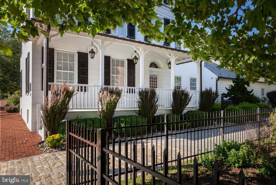 Set on an acre in the heart of West Chester Borough, this historic c. 1790 home with modern amenities retains its original charm and stunning architectural details. This property, known as the “David Townsend House,” was owned by the Chester County Historical Society until 2002, when it was purchased and restored for use as a private residence. Current owner added substantial enhancements in 2017. Enter into the large center hall foyer with wood floors that flow throughout the home. To the left you will find a cozy fireside living room which opens into the formal dining room, also with a fireplace. On the opposite side of the home is the thoughtfully designed eat-in kitchen which opens into the family room. Cooking and entertaining are a breeze in the kitchen with high-end stainless steel appliances, a large center island, and lots of cabinets and counter space. A stunning vaulted ceiling with exposed beams is the focal point of the family room, which also features built-ins, a fireplace, and French doors to the patio and yard. Off the family room there is a convenient mudroom area with a powder room and laundry. Utilize the study off the kitchen as a private home office. At the back of the home, you will find the main floor primary suite with walk-in closets and a luxurious en suite bathroom. The second floor features three bedrooms and two full bathrooms as well as a home gym and family room, while the third floor holds two additional bedrooms and a full bathroom. Within easy walking distance of all that downtown West Chester has to offer including shopping, dining, parks, and more!