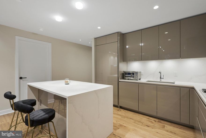 Experience the pinnacle of modern elegance in this exquisite 2-bedroom, 2-bathroom condominium at The Pierce, Rosslyn’s premier luxury residence. Designed for both comfort and sophistication, this home boasts floor-to-ceiling windows, bathing the space in natural light.
The sleek, high-end kitchen features gas cooking, top-tier appliances, and stylish cabinetry—perfect for culinary enthusiasts. Beautiful hardwood floors flow throughout the unit, adding warmth and refinement. A large laundry room with a deep sink offers convenience, while the private balcony provides an ideal setting for al fresco dining or a peaceful morning coffee.
Residents of The Pierce enjoy 24-hour concierge services, a rooftop patio with gas grills and panoramic views of DC and Arlington, and a rooftop community room designed for relaxation or entertaining. Additional amenities include a state-of-the-art gym on the second floor, a dedicated yoga room on the third floor, and a spectacular rooftop pool for unwinding in style.
This unit comes with two reserved parking spaces and is ideally located in the heart of Rosslyn, just steps from grocery stores, top-rated restaurants, and the Metro. With easy access to DC, I-66, and Amazon HQ2, this home offers unparalleled convenience in one of the region’s most sought-after neighborhoods.
Don’t miss this rare opportunity to live in a luxury residence at The Pierce—where modern design meets urban sophistication.