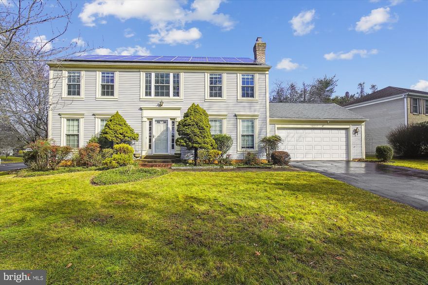 Come check out this meticulously maintained, energy efficient and beautifully updated center hall colonial! The fully owned Solar Panels (2021) convey with the property, saving over $2,400 annually in electricity costs! The main level of this home has gorgeous hardwood floors, a large formal living room, and dining room. The family room has a cozy fireplace with lovely decorative beams on the ceiling. The kitchen was renovated in 2019 and has new stainless-steel appliances, granite countertops, and classic white shaker cabinetry. The oversized mudroom/laundry room between the 2-car garage and kitchen is a wonderful bonus to this perfect floor plan. The mudroom also has a door to the back deck which is very helpful on those rainy/snowy days! The sliding glass doors leading to the large deck are perfect for grilling and get togethers out in the yard. The upper level includes 4 spacious bedrooms and 2 full bathrooms. The primary bedroom is over 200 sq ft and has a walk-in closet with built-in shelving. The updated primary bath has a lovely soaking tub. All 4 bedrooms have ceiling fans and center light fixtures. The fully finished basement was just painted and refreshed in January 2024 and is ready for its new owners! Numerous updates include a new energy efficient HVAC (2020), water heater (2021), dryer (2022), ridge cap for roof (2021) chimney cap (2021), whole house paint (2019 & 2024), freshly painted deck (2023), carpet on upper level and in basement (2019), backyard shed (2022), renovated mudroom with cabinets, shelves, and shoe rack (2021), and basement wired with surround sound and in-wall speakers. This home is as move in ready as they get!