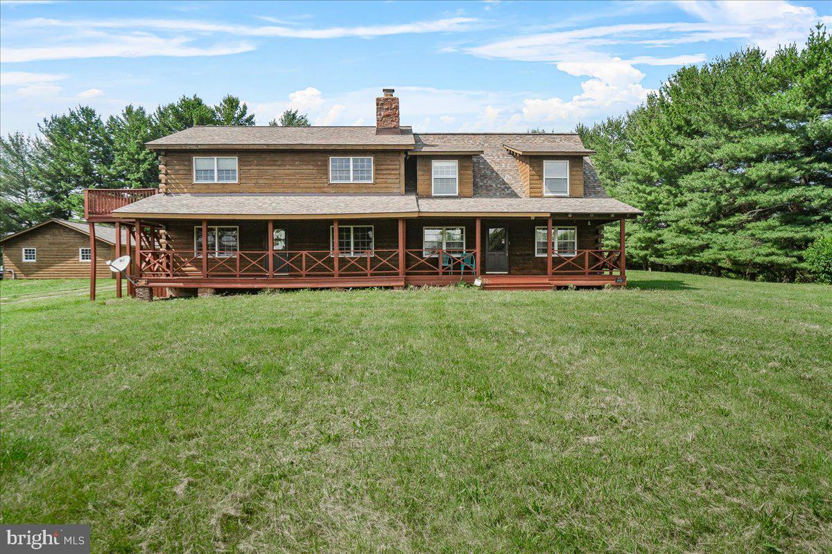 This 4 bedroom, 3.5 bath, 3-fireplaces and 3-car garage property is strategically positioned on the crown of a 13.5 acre wooded lot that includes a large pond and a large open porch that faces west. Nature lovers will enjoy the features of this property are invited to make this property theirs. Of course there is abundant room for expansion and further development of the rustic environment. All offers will be seriously considered.
