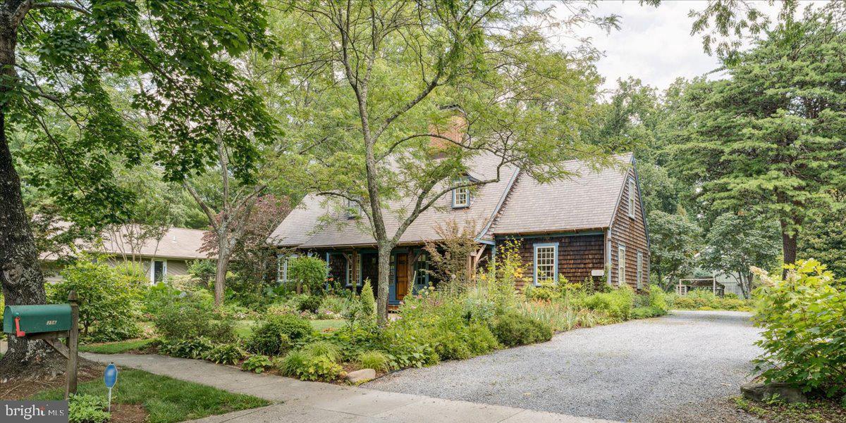 Welcome to this captivating “Country Cape” reproduction, inspired by an original 1754 home in New Milford, Connecticut. Nestled in the prestigious waterfront community of Broadview Estates in Annapolis, this exceptional property offers both historical charm and modern-day elegance.
Crafted with intention and care, the home features hand-built cabinetry in the kitchen and wet bar—designed and constructed by the owner—as well as artisan-crafted interior doors and rich wood-beamed ceilings that lend warmth and character throughout. The main living areas flow seamlessly from kitchen to dining to living room, opening effortlessly onto a private brick patio and professionally designed gardens—a serene extension of the home that invites year-round enjoyment.
Outdoors, the grounds are a true masterpiece. Curated by a Master Gardener, the landscape has earned its place in the Maryland Garden Tours and Home of the Week features. From morning coffee among the blooms to evening chats on the inviting front porch, this property is designed for peaceful, refined living.
The cozy living room, anchored by a classic wood-burning fireplace, is perfect for intimate gatherings or quiet nights in. A spacious eat-in kitchen offers the ideal setting for entertaining, while a dedicated office on the main level provides flexibility as a work-from-home space or additional bedroom.
Upstairs, the primary suite is a restful retreat with an en-suite bath. Two additional bedrooms—one with a charming skylight overlooking the gardens—offer comfort for guests or family.
A deeded 12’ x 25’ boat slip in Broadview’s private marina conveys with the property, providing easy access to the Chesapeake Bay lifestyle. Additional features include a two-car garage, workshop, garden shed, and ample storage.
This is more than a home—it’s a lifestyle. Classic architecture, artisan details, and breathtaking gardens make this a rare offering in one of Annapolis’ most desirable neighborhoods.