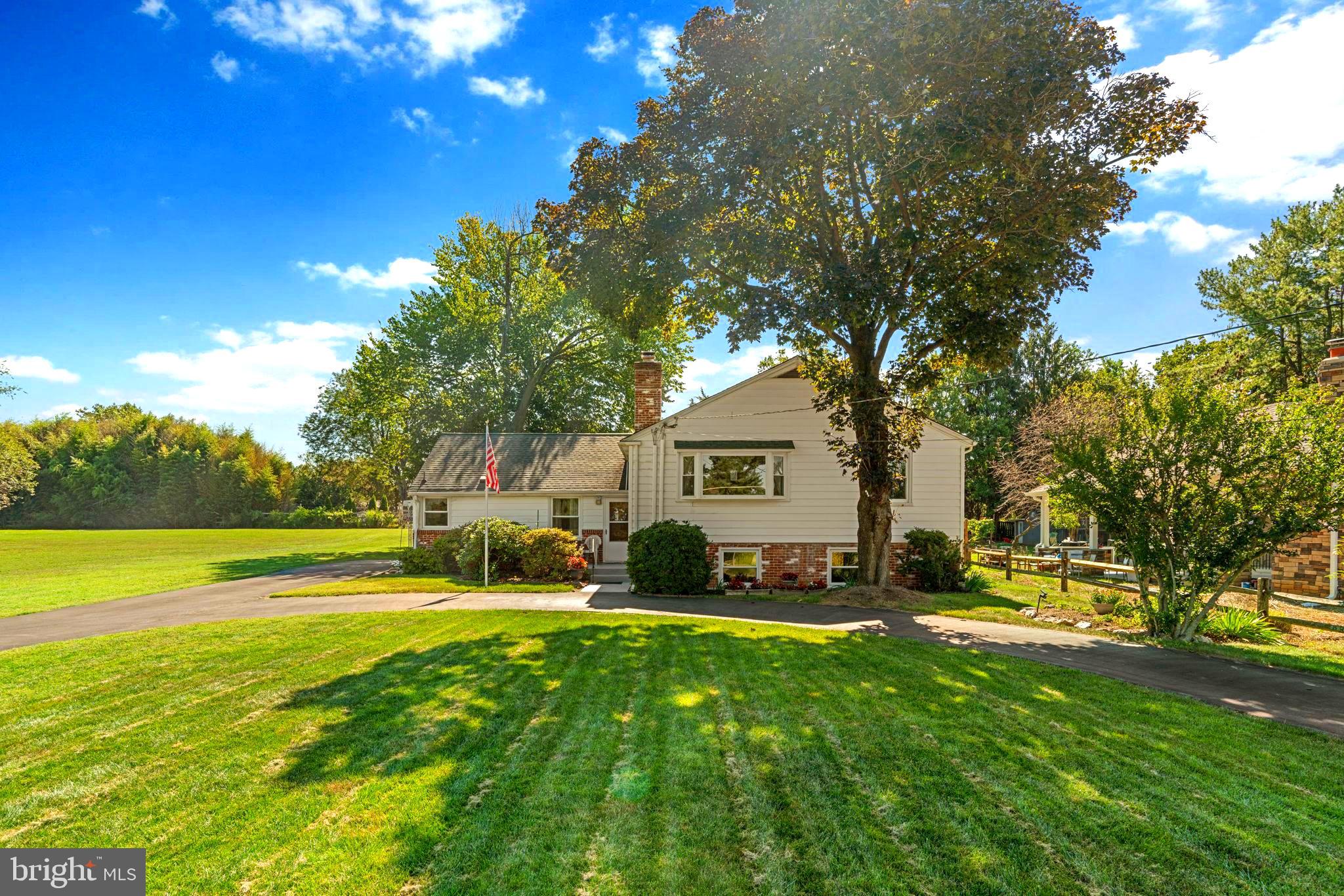 You will love everything about this quiet oasis set on a beautiful 0.47-acre lot. This meticulously maintained charming home offers an abundance of space inside and out, blending comfort, flexibility, and convenience. With multiple gathering areas, a thoughtful floor plan, and direct access to a nearby community park with basketball, pavilion, and play area, it’s the perfect setting for everyday living and entertaining.
The welcoming entry opens into a bright foyer and dining area that flows easily into the kitchen. The kitchen offers generous cabinetry, counter workspace, and a sink in sunny corner window to take in your beautiful land creating an ideal spot for meal prep and casual dining. Just beyond the kitchen you’ll find a desk area and full bathroom.
Upstairs, the home continues to impress with a spacious primary bedroom suite (18’ x 12’) offering ample room for a king-size bed and seating area. Two additional bedrooms, each with closets, share a well-sized hall bath. An oversized living room (18’ x 19’) with a cozy fireplace adds rare versatility to the upper level!
The home expands into a sprawling family room measuring 26’ x 19’ with yet another warm and inviting fireplace, perfect for hosting large gatherings or quiet evenings at home. A dedicated home office (13’ x 13’) provides privacy for work, study, or creative projects, while the laundry/mudroom connects to backyard for easy indoor-outdoor living and has access to the crawl space.
The home’s outdoor spaces are just as inviting as the interior. The covered patio creates an ideal spot for outdoor dining, morning coffee, or unwinding while overlooking the expansive, level backyard. With nearly half an acre, there’s room for gardening, play, and entertaining. A shed provides convenient storage, while the circular driveway allows for an abundance of parking for added convenience.
Located in a peaceful residential setting, this property offers ultimate privacy. Step outside to enjoy the adjacent park with basketball court, playground, and pavilion, or take advantage of nearby shopping, dining, and commuter routes for daily convenience.